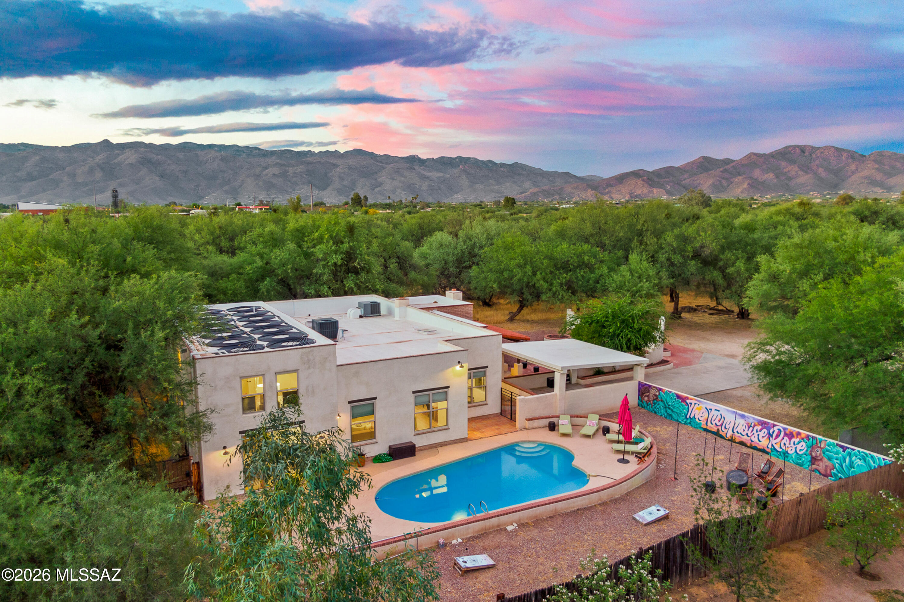 A rare desert retreat where luxury and privacy come together seamlessly. Nestled on an expansive lot, this exceptional property feels like your own private resort, surrounded by mature landscaping and breathtaking outdoor spaces. The backyard is a true showpiece, featuring a stunning pool, multiple areas for entertaining, and a tranquil setting designed for both relaxation and unforgettable gatherings. Inside, thoughtfully designed living spaces are filled with natural light and timeless elegance, creating an atmosphere that is both sophisticated and welcoming. Offering the perfect blend of comfort, exclusivity, and Arizona lifestyle, this is more than a home--it's a private oasis.