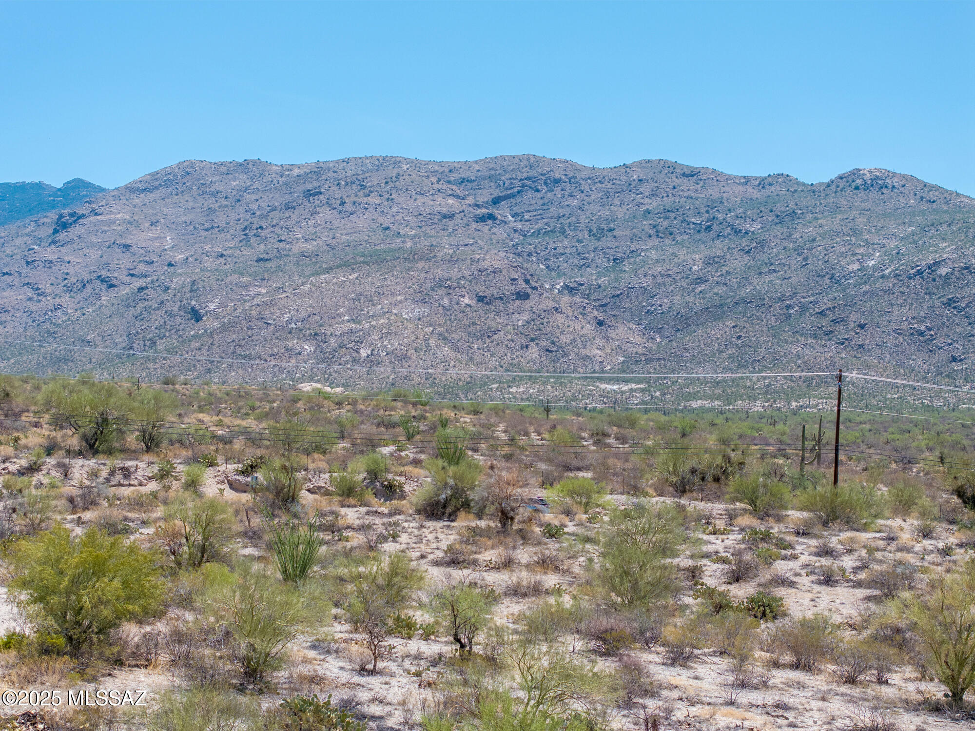 Experience the splendor of living in the backyard of the Saguaro National Park, Breathtaking Luxury home community located in the foothills of the Rincon Mountains. Magnificient mountain views and city lights. Gated and private this 3.3 acre lot with large building envelope is located adjacent to the Huckelberry loop biking trail. Also close to horseback riding and hiking trails while only minutes from the airport, downtown, shopping, new Northwest Hospital facility less than a mile away. Also nearby; University of Arizona Science and Technology Park.  Surrounded by amazing custom homes. Located in the Tanque Verde School District.  This lot will not disappoint!!!