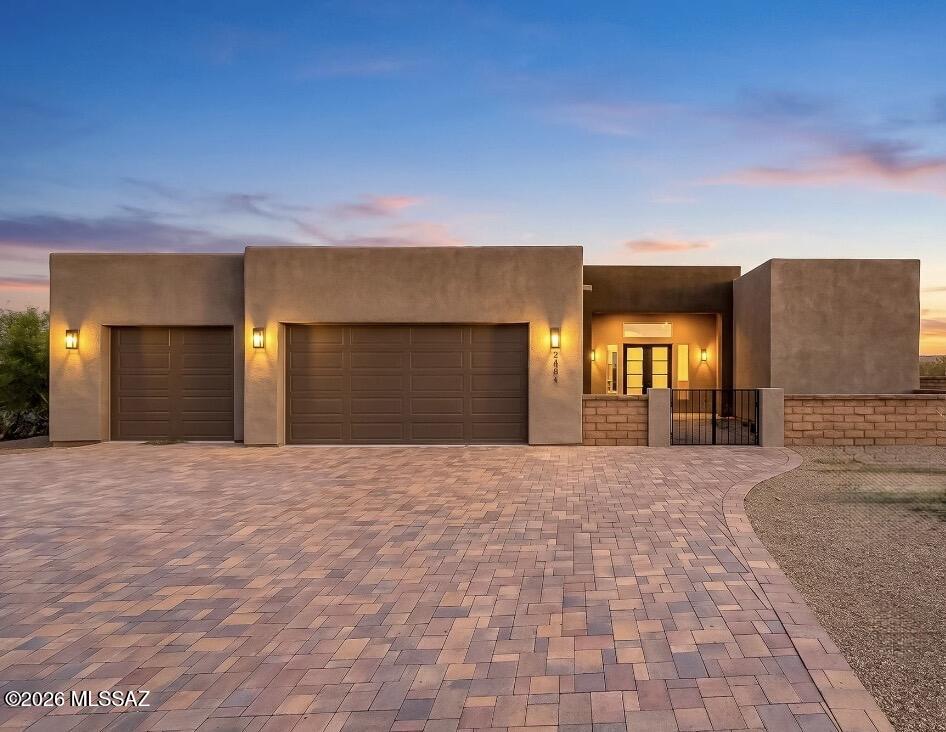Welcome to your sanctuary in the prestigious gated community of Stone House, where luxury meets modern living in this exceptional 4-bedroom, 3-bath home. Set on nearly an acre of beautifully landscaped grounds, this residence offers an inviting and tranquil retreat that is both stylish and functional. As you enter, you are greeted by an expansive open floor plan with elegant tile flooring, complemented by high ceilings that enhance the spaciousness and natural light throughout.

The heart of the home is the exquisite kitchen, featuring sleek granite countertops and stainless-steel appliances, perfect for culinary adventures and entertaining guests. Each of the three bathrooms is thoughtfully designed with modern elegance in mind, showcasing contemporary showers that create a spa-like - experience. The primary suite is a true sanctuary, complete with a spacious walk-in closet and an ensuite bath designed for relaxation and comfort.

Three additional bedrooms provide flexibility for family, guests, a home office, or creative space, making this home as versatile as it is beautiful.

The outdoor space offers endless possibilities for leisure, entertaining, gardening, or simply enjoying the peaceful surroundings. This property is a seamless blend of sophistication and comfort, making it the perfect place to call home in the highly desirable Stonehouse community. Don't miss the opportunity to experience this exceptional lifestyle!