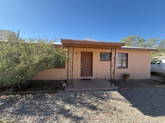 2 BR/1 BA, end unit of a triplex. Great central location. Tile flooring throughout living area with carpeting in both bedrooms. Updated kitchen with fridge & gas stove. Mini split system for air conditioning in 2 Bedrooms and Living Rm, Central Gas Heat. Laundry/storage room with washer & dryer hook-ups Inside.  Fenced yard. Off  street parking. Pet considered subject to owner approval. Water/sewer/trash service paid by owner. Tenant pays gas & electric.