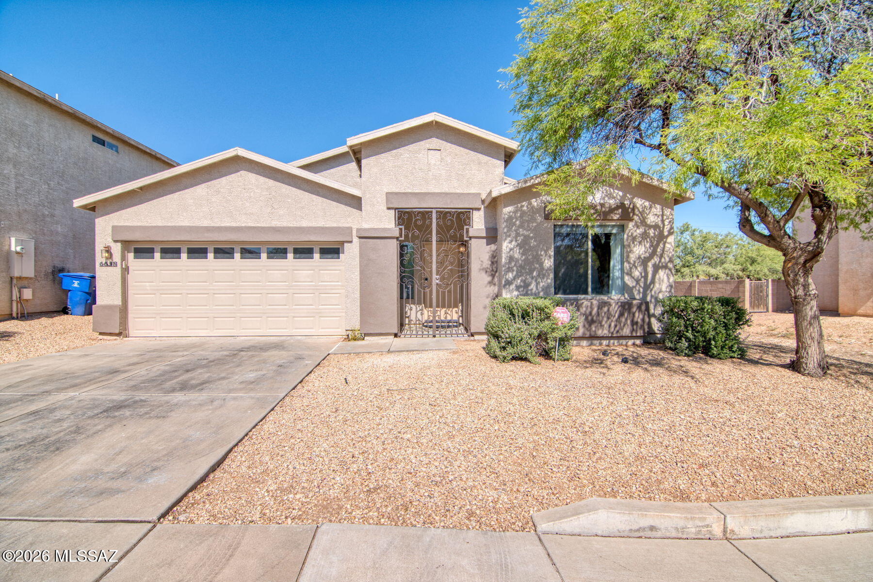 Range priced $299,900-$309,900. This beautifully remodeled 3 bedroom, 2 bathroom home with thoughtful upgrades inside and out. Step through the custom entry gate into a warm and inviting interior featuring tile flooring throughout, a wood-burning fireplace in the living room, and tasteful modern finishes throughout the home. The updated kitchen offers quartz countertops, a custom backsplash, stainless steel appliances, and a sleek single-basin sink, creating a clean and functional space for everyday living and entertaining. Major updates include a brand new HVAC system and newer water heater for added peace of mind. Outside, enjoy a paved covered patio overlooking low-maintenance turf, flower beds, and irrigation. Community amenities include a neighborhood playground and park conveniently nearby.