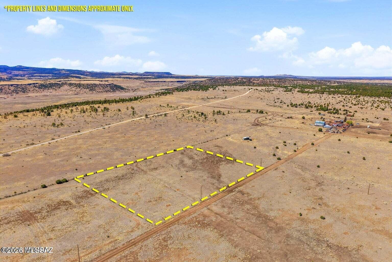 No HOA or deed restrictions--bring your horses, RVs, and mountain dreams! Beautiful 7.99-acre flat pasture parcel with stunning open views of the Escudilla Mountains. This rare property offers expansive pastureland that is very close to the forest, providing incredible privacy and endless riding and recreation opportunities. Ideal for horses and other animals, with the ability to ride directly from your property onto nearby forest trails. With no HOA or deed restrictions, the possibilities are wide open--build your dream home, place a manufactured home, or bring your RVs and enjoy the mountain lifestyle. Utilities run along the property line, and area wells are typically drilled at approximately 200 feet. The parcel has been previously staked and surveyed, making it ready