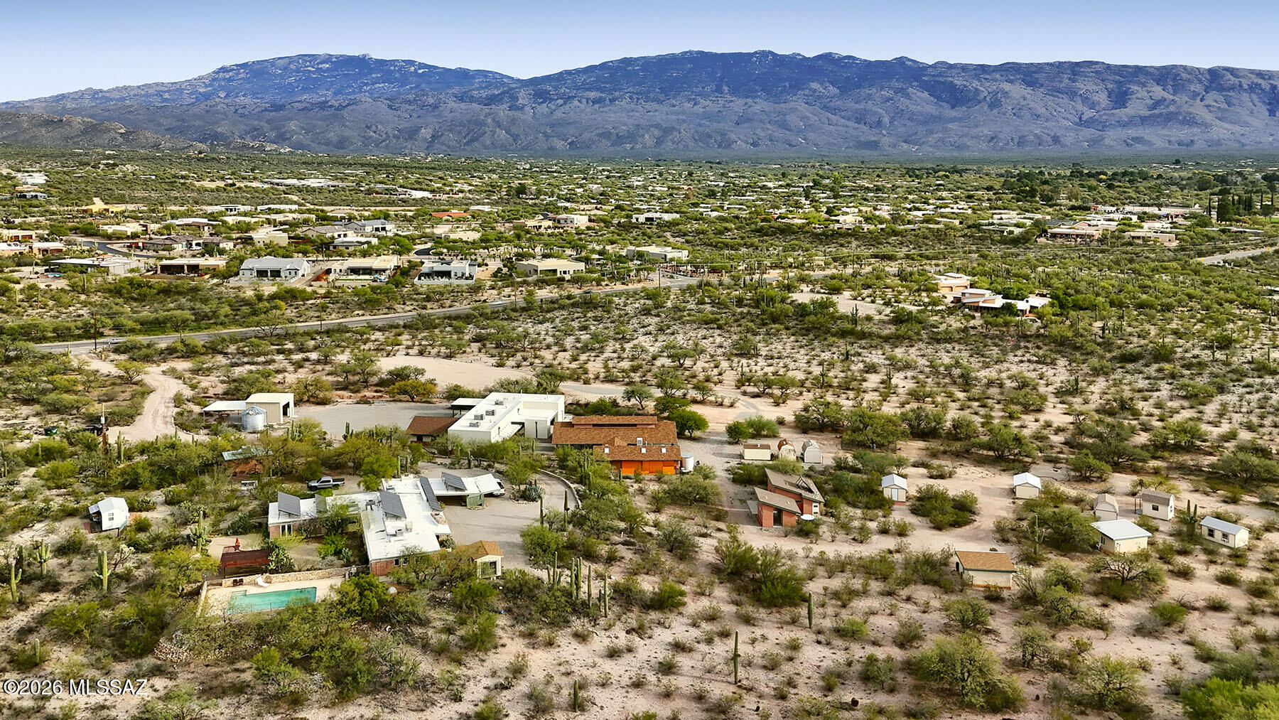 Rare 10.5-acre Northeast Tucson desert estate offering privacy, flexibility, and nearly 10,000 SF of
improvements unlike anything else on the market. The property includes a hilltop primary residence with attached guest quarters, a detached guest house, two straw bale sleeping cottages, a Class A multipurpose building,barn-inspired ramada, garage, equipment/storage buildings, and additional improvements. Ideal as a multi-generational family compound, equestrian estate, wellness retreat, or private sanctuary. Zoned Suburban Ranch (SR) with potential for two additional lot splits and an existing Special Use Permit allowing educational use. A true one of a kind property offering endless possibilities.