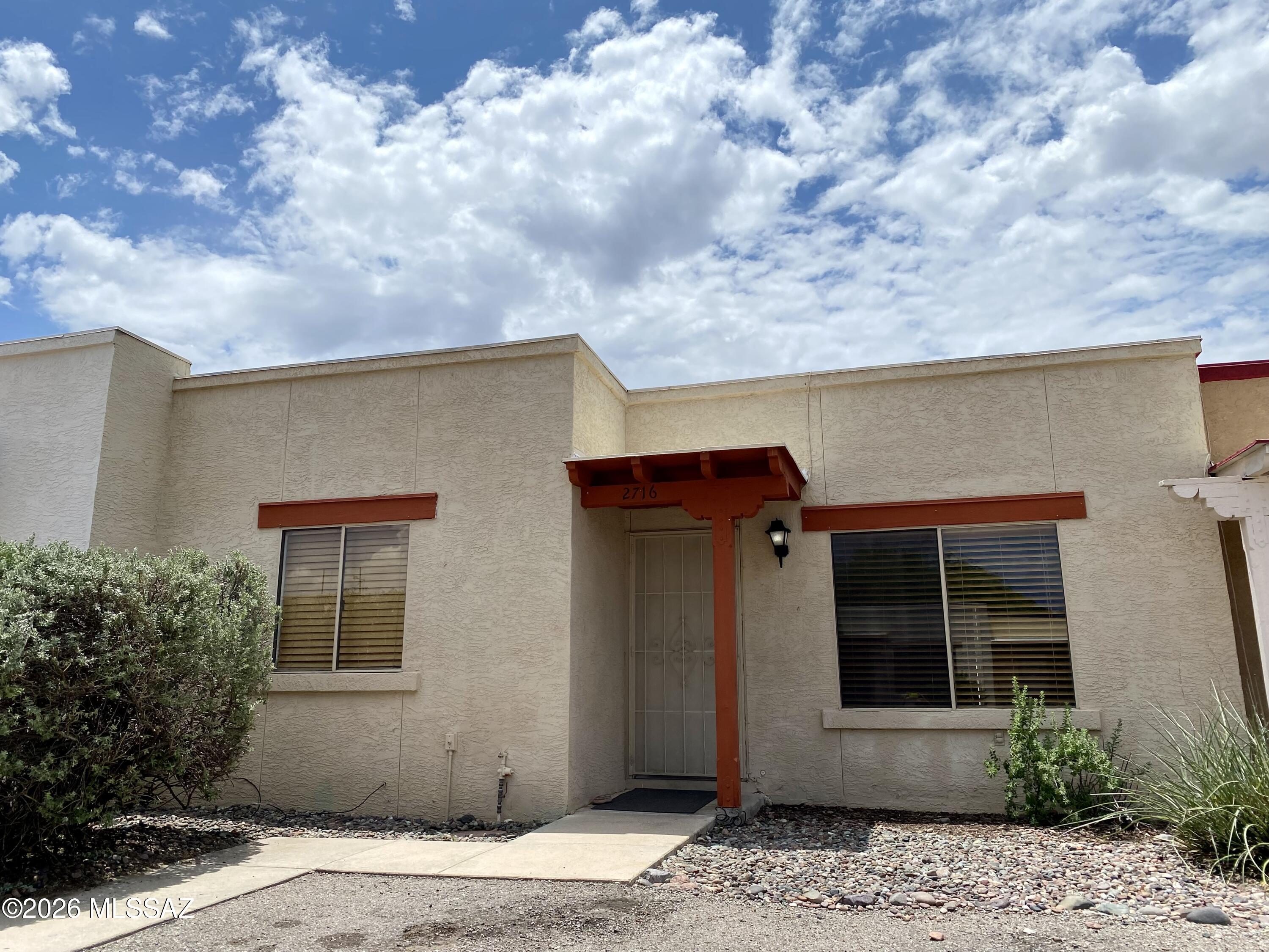 Discover an inviting and affordable place to call home on Tucson's east side. This well-kept 2-bedroom, 1-bath townhouse is clean, move-in ready and especially well suited for a first-time homebuyer. The bright interior includes skylights in the kitchen and bathroom, while a separate exterior laundry room adds everyday convenience. Enjoy a spacious private backyard with possibilities for outdoor dining, gardening, pets or peaceful evenings under the Tucson sky. Two parking spaces directly in front of your unit are designated for the property. Come see how easily this charming home could become your own!