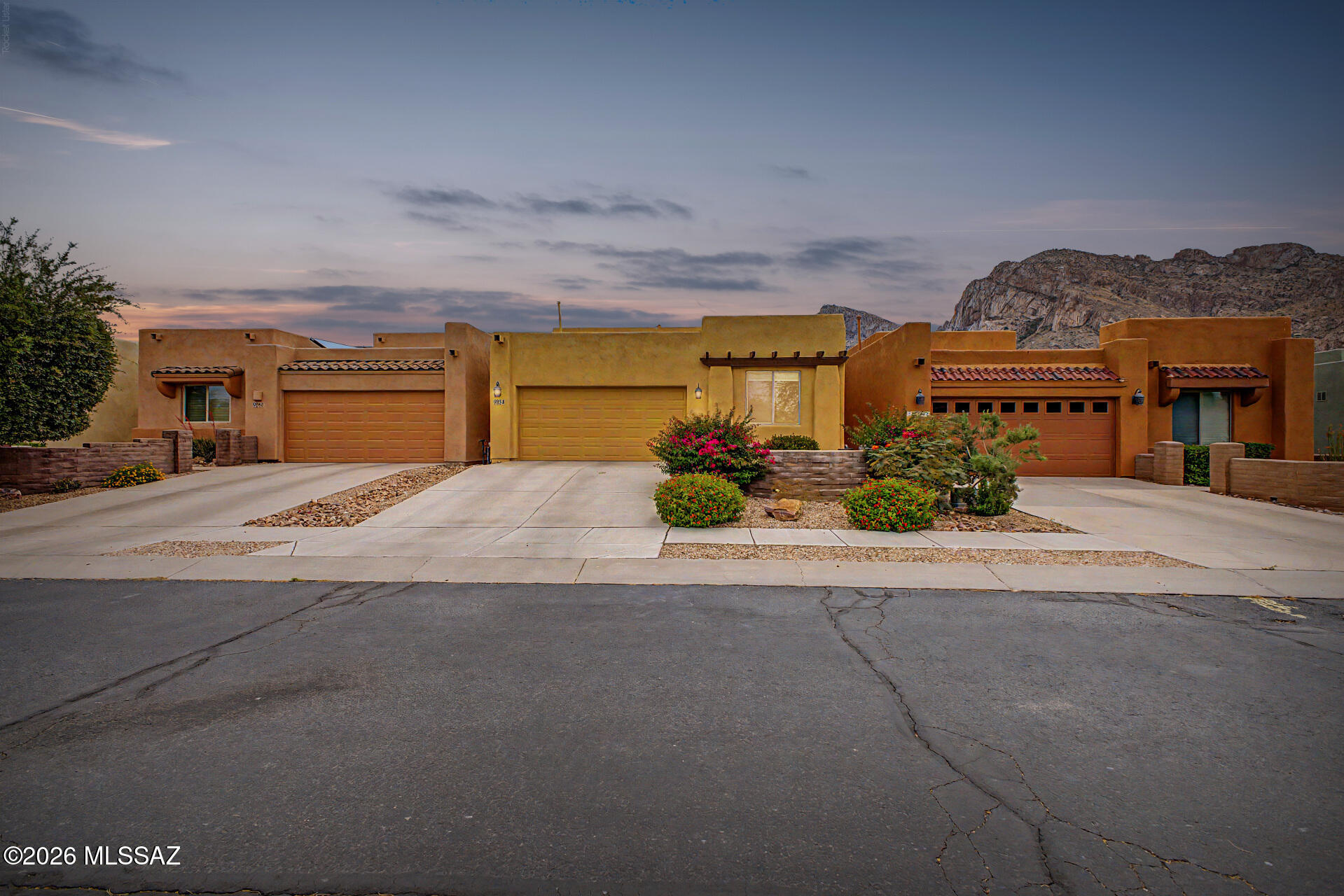 Nestled in a tranquil gated community, this home offers breathtaking, majestic views of the Pusch Ridge mountains. The spacious great room features soaring ceilings and large windows that fill the home with abundant natural light. A desirable split-bedroom floor plan provides privacy, with a generously sized primary suite for comfortable living. The east-facing backyard is perfect for enjoying peaceful mornings and cooler afternoons. Ideally located near the scenic river walk, with a community park and open space just across the street. Charming front entry courtyard greets visitors. Finished in a timeless neutral palette, this home is move-in ready and designed for both relaxation and entertaining.