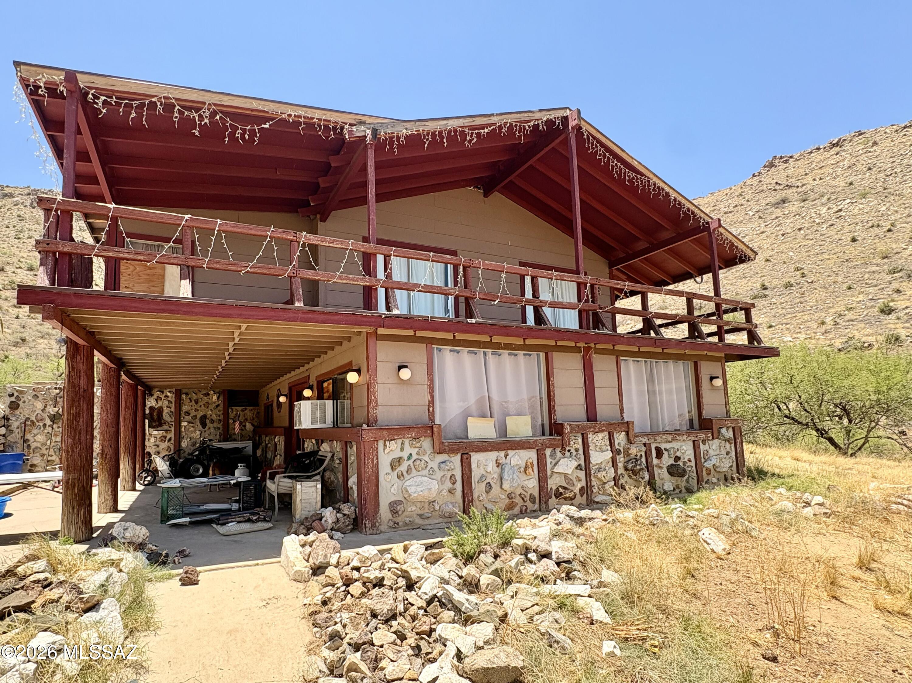 Located just minutes from Charron Vineyards, this unique hilltop retreat offers just over 4 acres of mountain views, unmatched privacy, and endless potential. 
If you've been searching for a property where you can create a rural escape while building instant sweat equity, this is it!
With a private well and septic, you're practically off grid - this handyman special is ready for your vision. Offering a functional layout and the opportunity to update and personalize cosmetic finishes to truly make it your own. Bring your horses, RVs, trailers, or workshop plans-there's room for it all. Whether you're looking for a peaceful homestead, a hobby farm, or a weekend getaway by the vineyards, this property provides the space and freedom to do whatever your heart desires.
