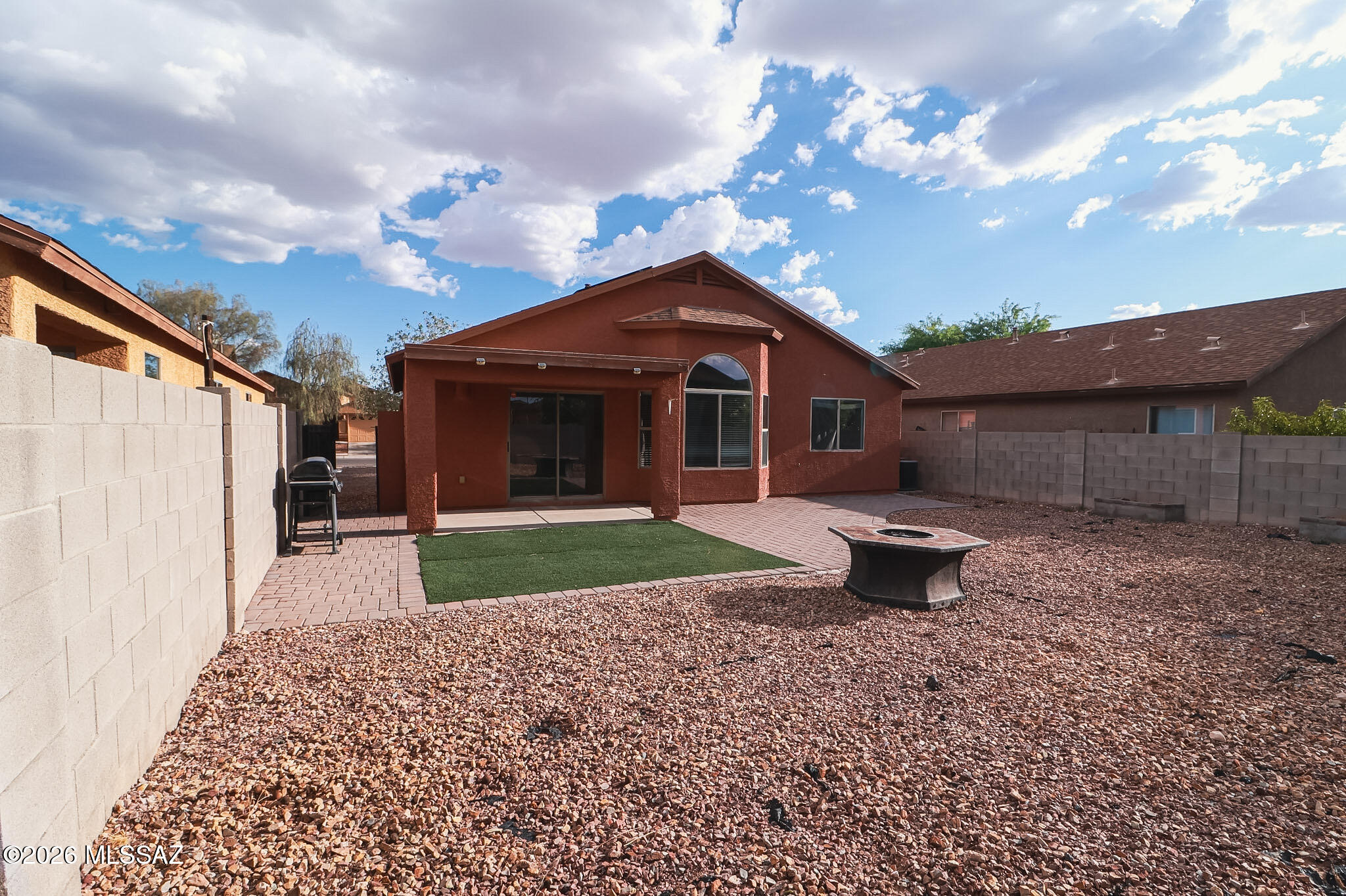 Discover this move in ready 3 bedroom, 2 bathroom home in South Tucson, offering a bright open floor plan with soaring vaulted ceilings and an abundance of natural light. The spacious living area flows effortlessly into the kitchen, featuring generous cabinet storage, ample counter space, and a layout designed for both everyday living and entertaining. The private primary suite includes a large walk in closet, dual sink vanity, and separate shower, creating a comfortable retreat. Two additional bedrooms provide plenty of flexibility for family, guests, or a home office. A dedicated laundry room and neutral finishes throughout add convenience and make it easy to add your personal style. Conveniently located with quick access to shopping, dining, schools, parks, and major roadways, this home is ideal for first time buyers, growing families, or investors looking for a great opportunity in the South Tucson area. Don't miss your chance to own this inviting home.