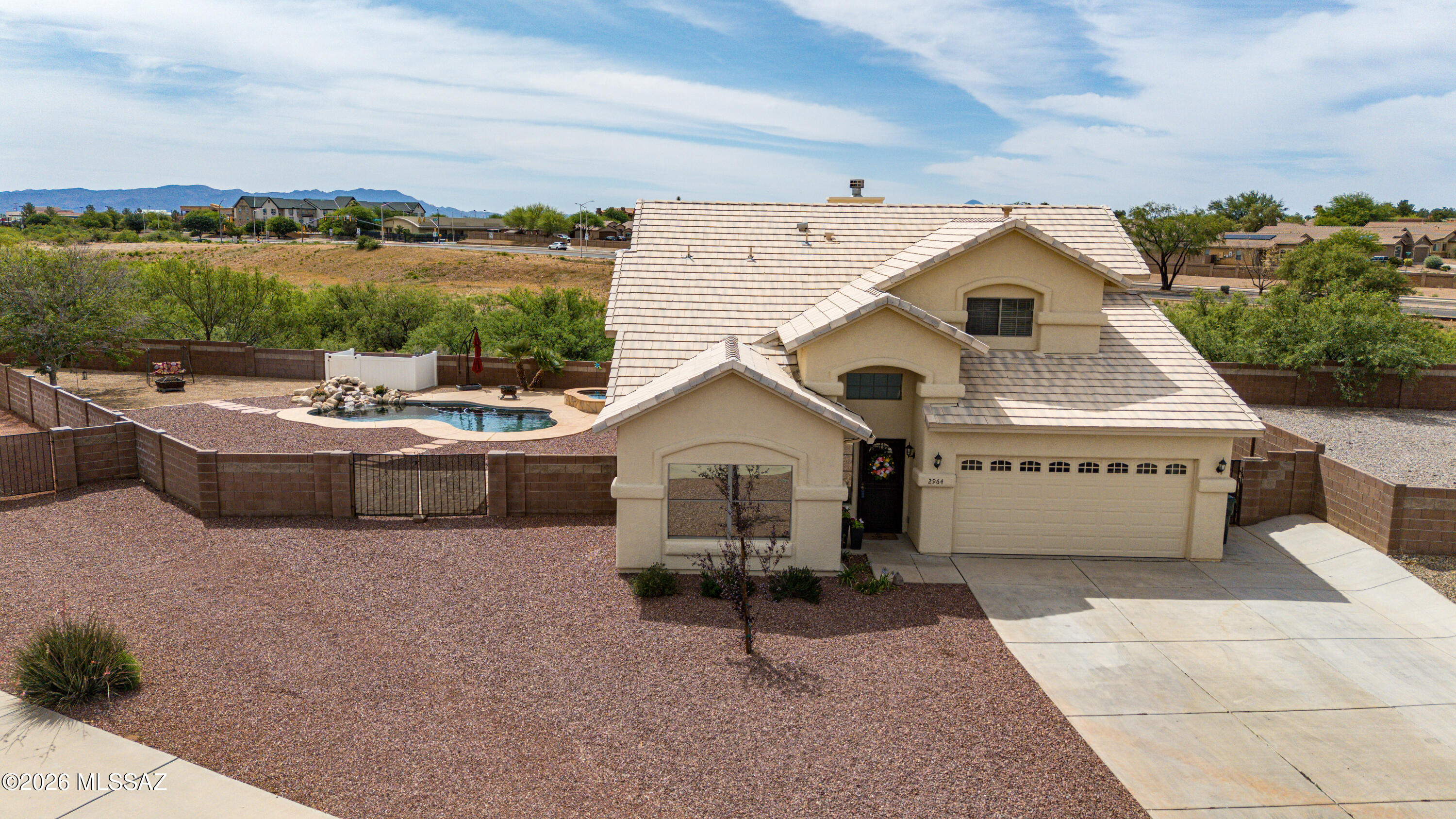 Welcome home to this 4 bedroom, 3 bath home offering 2,222 sqf of comfortable living on a generous ¼-acre cul-de-sac lot. No neighbors behind allows breathtaking mountain views. The expansive backyard features plenty of room to entertain, a heated PebbleTec pool and spa (heater replaced 2026), and a two year old shed for additional storage. Updated landscaping 2026. The floor plan features a bright great room, formal dining area, and a cozy family room with a wood-burning fireplace just off the eat-in kitchen. The kitchen is equipped with stainless steel appliances, while tile flooring extends throughout the main level. A first-floor bedroom and full bath provide flexibility for guests or a home office. Upstairs, the primary suite offers a walk-in closet, separate shower, and relaxing tub