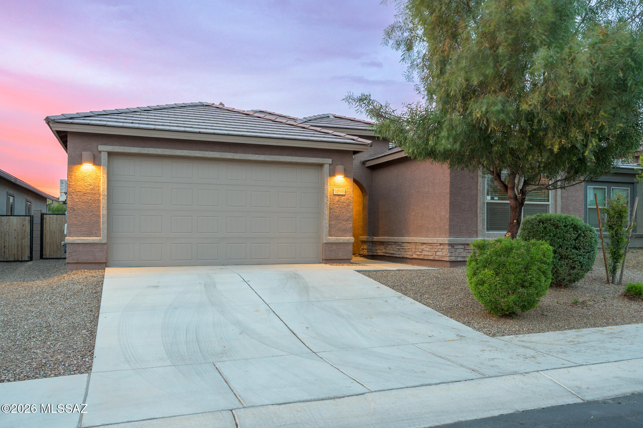 Range Priced at $374,900-$394,900.
Welcome to 10916 W Claxton--where flexibility meets function and the layout actually makes sense for real life. This thoughtfully designed 4-bedroom, 2-bath home isn't just move-in ready--it's ready to work for you. Owned solar is already in place--because a little help with those energy bills never hurts. Inside, you'll find a smart split floor plan that gives everyone their own space while still keeping connection at the heart of the home. Two secondary bedrooms are tucked around a versatile bonus room--perfect for a playroom, home gym, media space, or even a next-gen setup. It's the kind of layout that adapts to your life, not the other way around. The main living and dining areas each have their own space but flow effortlessly together, giving you that open-concept feel without sacrificing function. Whether you're hosting friends or keeping it low-key, it just works. Out back, the low-maintenance yard with decorative gravel is your blank canvas--ready for a fire pit, turf, string lights, or whatever Pinterest board you've been saving. And the location? Right where you want to be--close to neighborhood parks, miles of walking and biking trails, The Loop, Fry's Marketplace, new shops and restaurants, dog parks, and the Marana Aquatic & Recreation Center. A home that gives you options, a layout that actually lives well, and a neighborhood that keeps getting better-this is one you don't want to miss.