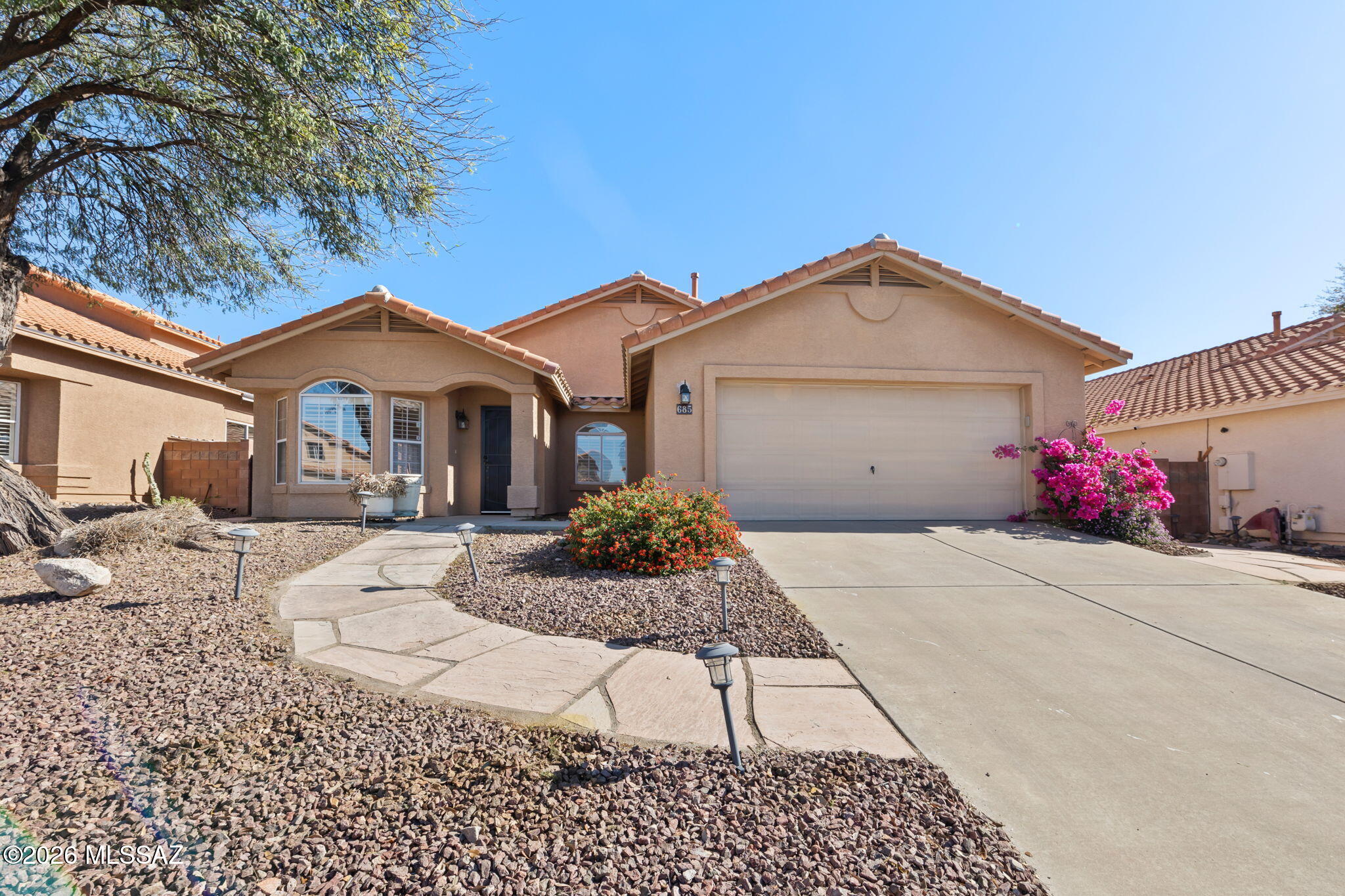 Mountain views, sunshine, and space to breathe--welcome home to this beautiful Oro Valley retreat.
This single-story 3-bedroom home offers an airy great room with expansive living space, perfect for gatherings or cozy nights in. The open kitchen features stainless appliances, a large island, and plenty of cabinet space to keep everything organized while you cook and entertain.
Need a home office, hobby room, or movie den? The separate den adds flexible living space to fit your lifestyle.
Out back is where the magic happens. The landscaped backyard showcases mountain views, mature desert plants, winding stone paths, and charming garden seating areas--your own peaceful desert oasis.
If you're looking for space, views, and a relaxed desert lifestyle, this home delivers.