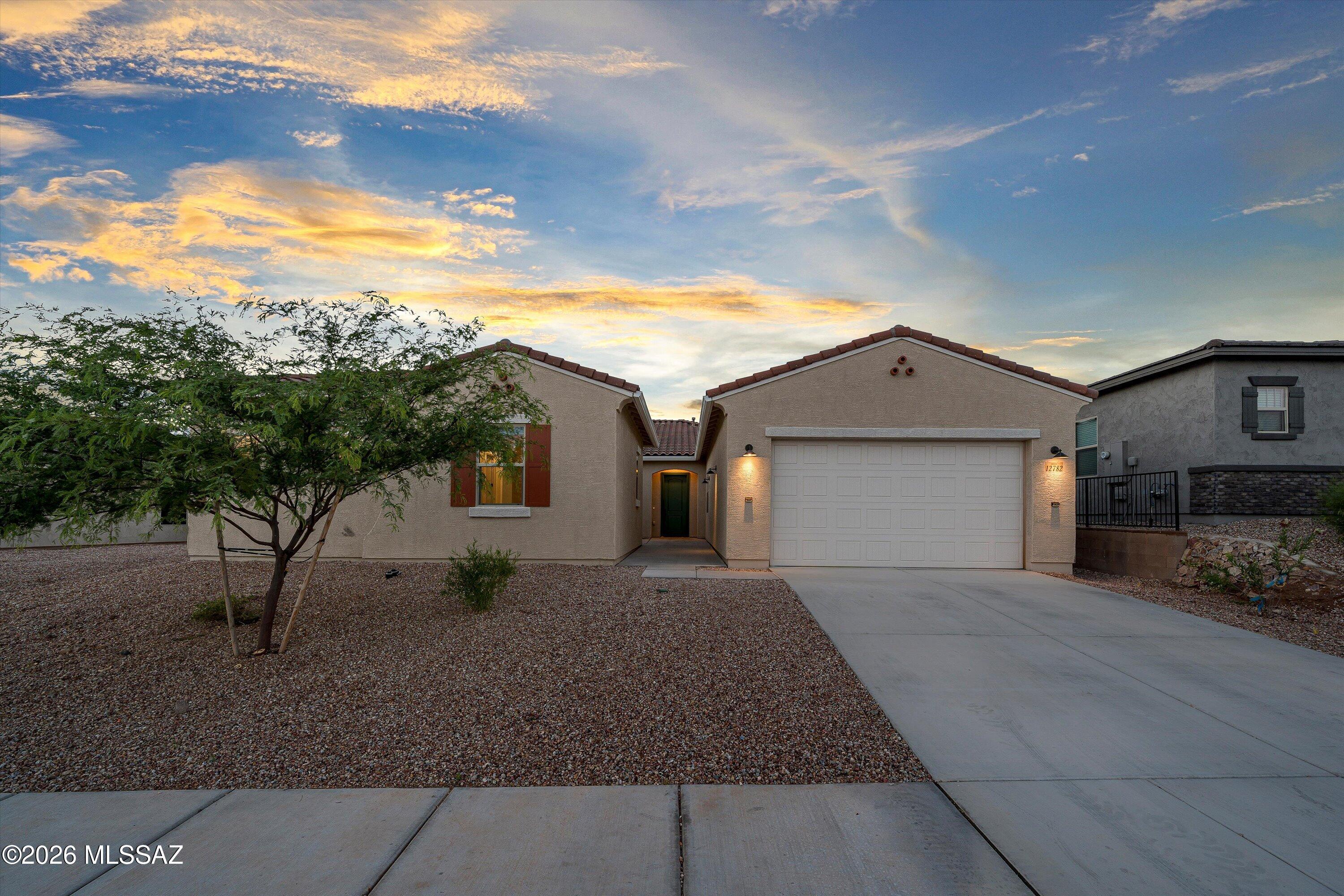 Built in 2024, this 3,229 sqft Mint floor plan features 4 bedrooms, including one with a private en-suite bath, along with 3.5 baths, a study, and bonus room. Inside, you'll find 10-foot ceilings, 8-foot doors, and a gourmet kitchen featuring an oversized island, large gas cooktop with vent hood, quartz counters and large walk-in pantry. The flexible layout provides room for work, guests, and everyday living, while the open-concept living areas offer plenty of space to gather and entertain. A 3-car garage provides ample storage and parking. Located directly across from the neighborhood park in gated Rincon Knolls and within the Vail School District, this home combines the benefits of recent construction with a functional floor plan in a convenient location.