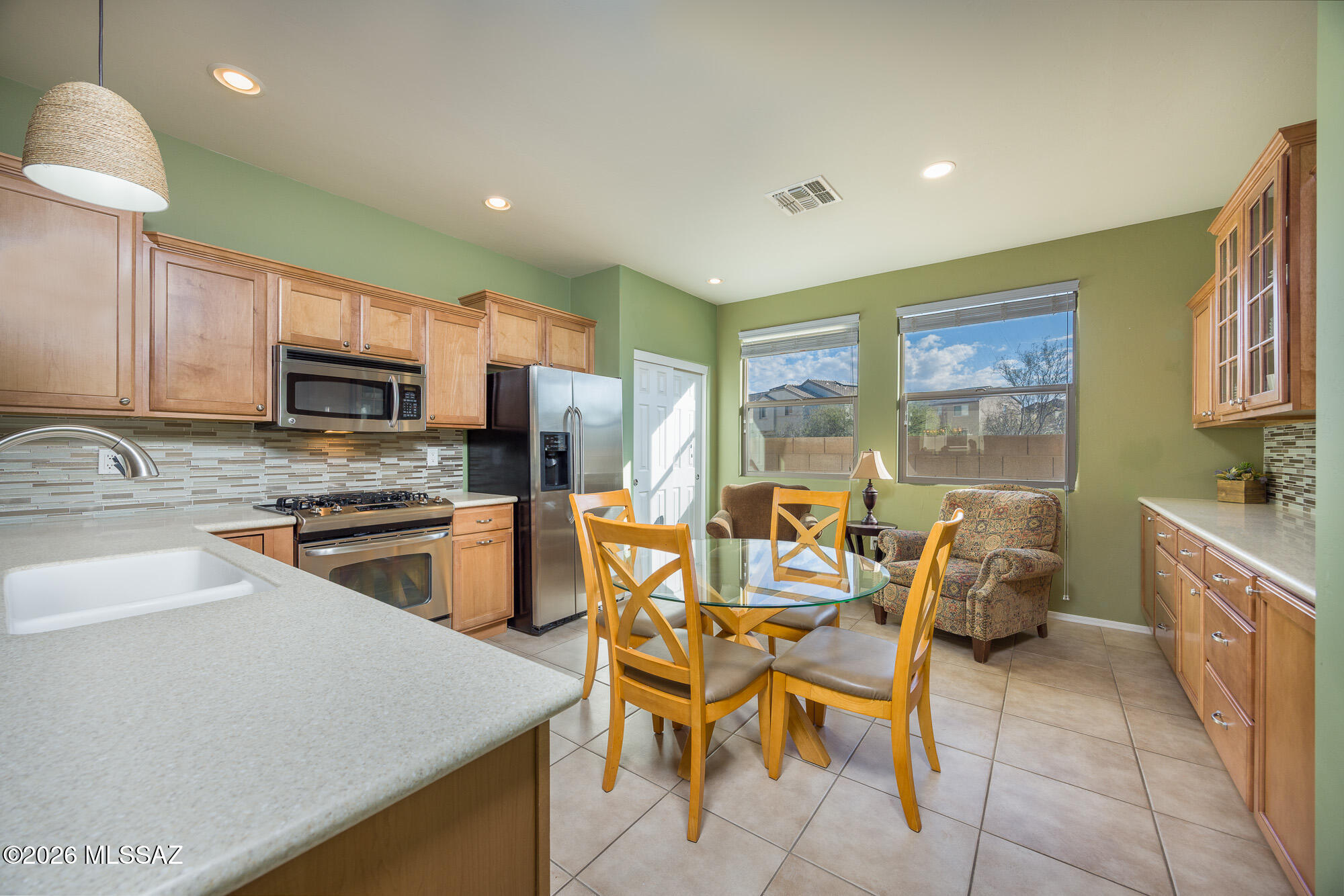 Prime View Lot Borders Dedicated Open Space Offering Privacy & Tranquility | Immaculate & Move-In Ready | Original Owners | Expanded Kitchen with Custom Cabinetry & Eat-In Dining is Unique within the Community | Nestled within the award-winning Vail School District boasting unobstructed views of the Rincons & Catalina Mountains, this light & bright home features 9' ceilings throughout. A true split bedroom concept floor plan offers peaceful living. Garage features built-in storage cabinets & epoxy floors.  Yard and Patio offer room to entertain or relax while taking in the amazing scenery  Tucked away for quiet living, yet conveniently located along the Houghton corridor for easy access to shopping, dining, medical, hospitals, schools. Minutes from The Loop, I-10, DM-AFB, Amazon, Raytheon