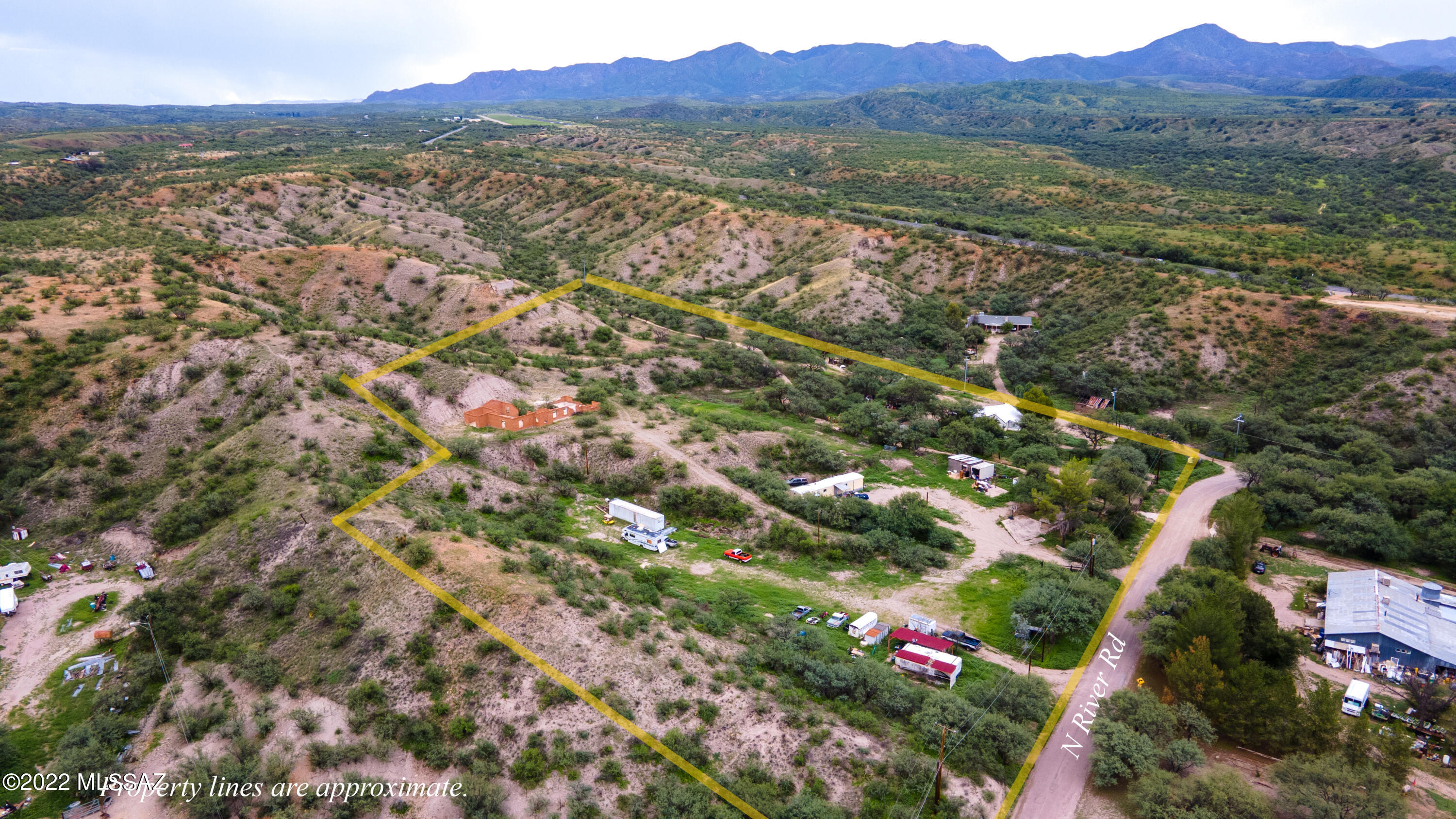 A very nice property !!  This beautiful 6.28 acres is located off of Highway 82 on North River Road.   Has several nice building sites you would like to build your dream home!!
There is an unfinished ''shell on top of one the hills made of Guevavi Adobe Brick... Views are absolutely gorgeous!!  There is a 2 BR 2 BA mobile home that conveys and also a privately owned trailer that brings in $300/mo..  Electricity and a very efficient well service the property !!