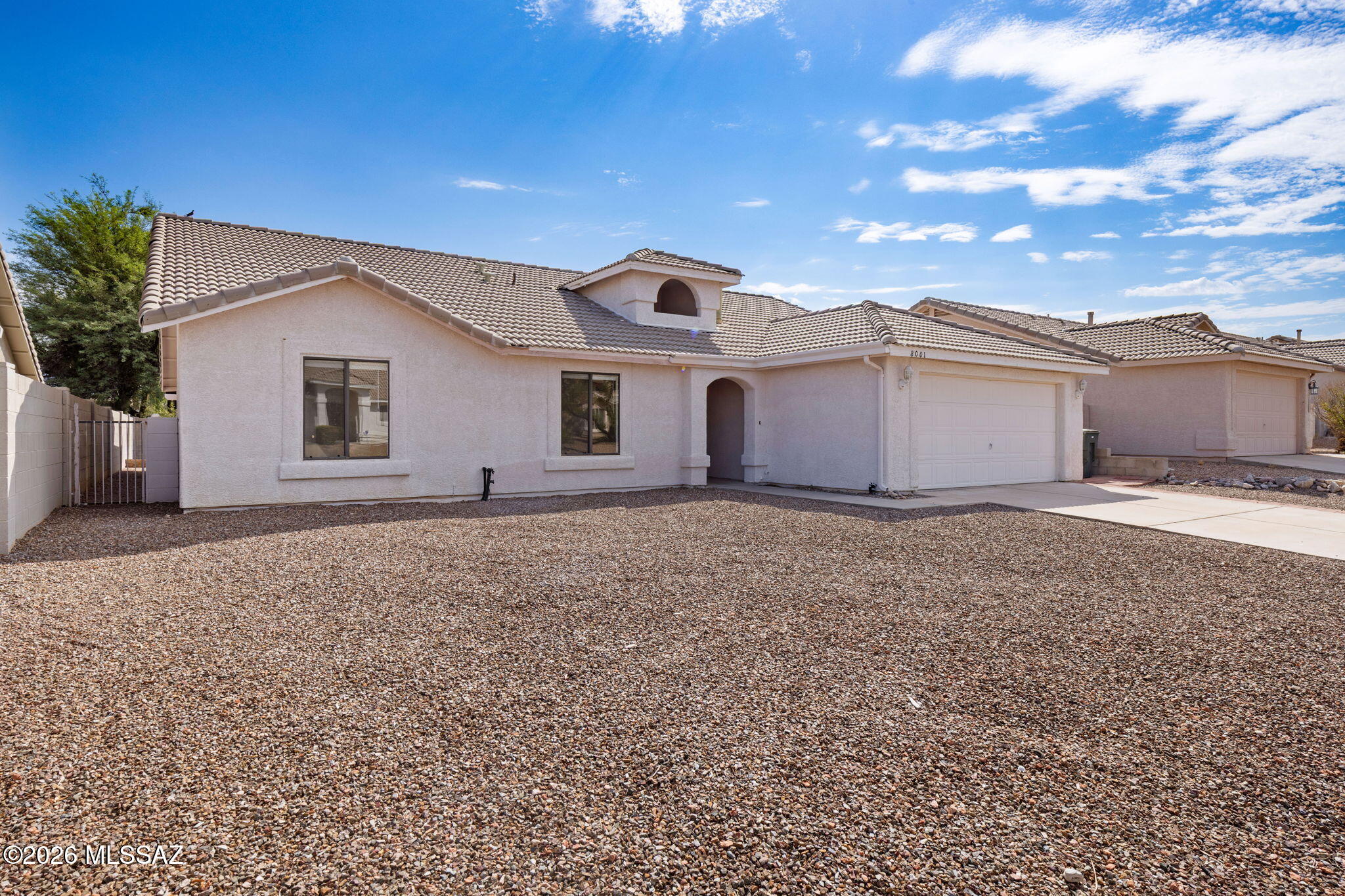 Move-in-ready 4-bedroom, 2-bath single-story in the heart of Rita Ranch, offering approximately 2,156 sq ft in the award-winning Vail School District. This larger floor plan features an open, light-filled living area, a functional kitchen, and a spacious primary suite, all freshened with new carpet and paint. Enjoy easy one-level living with a 2-car garage, covered patio, and a low-maintenance backyard. Tile roof and central cooling. Ideally located near Purple Heart Park, shopping, dining, and I-10 for a quick commute. No HOA. A comfortable, turn-key home in one of Southeast Tucson's most established neighborhoods. Fresh new carpet!