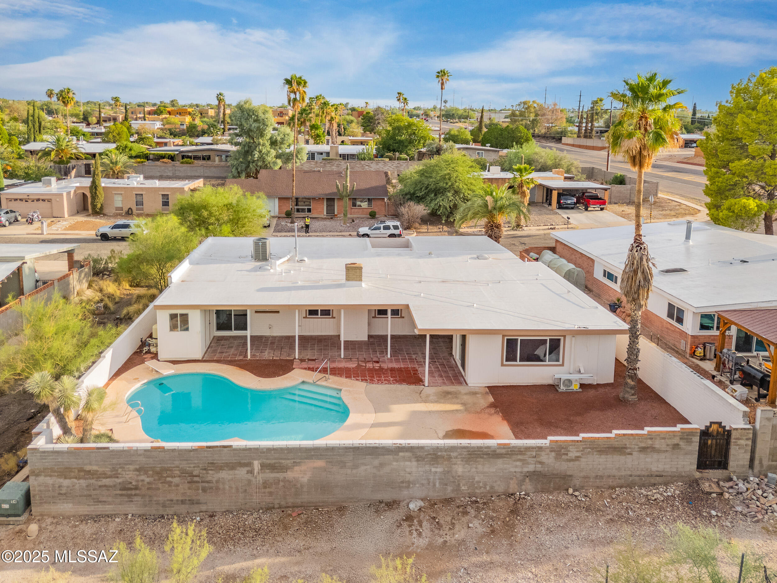 Fully remodeled and move-in ready! This beautifully updated home features a desirable split floor plan with two primary suites, perfect for flexible living or multi-generational needs. Enjoy stunning unobstructed Catalina Mountain views from your private backyard retreat, complete with a sparkling pool for year-round relaxation. Inside, you'll find a spacious living area with a cozy wood-burning fireplace, a brand-new kitchen with granite countertops, new appliances, and updated cabinetry, plus remodeled bathrooms and upgraded windows for comfort and efficiency. A new roof provides peace of mind, while thoughtful finishes throughout create a modern yet inviting feel. This home is move-in ready and waiting for its next owner to enjoy both style and comfort in a prime location!