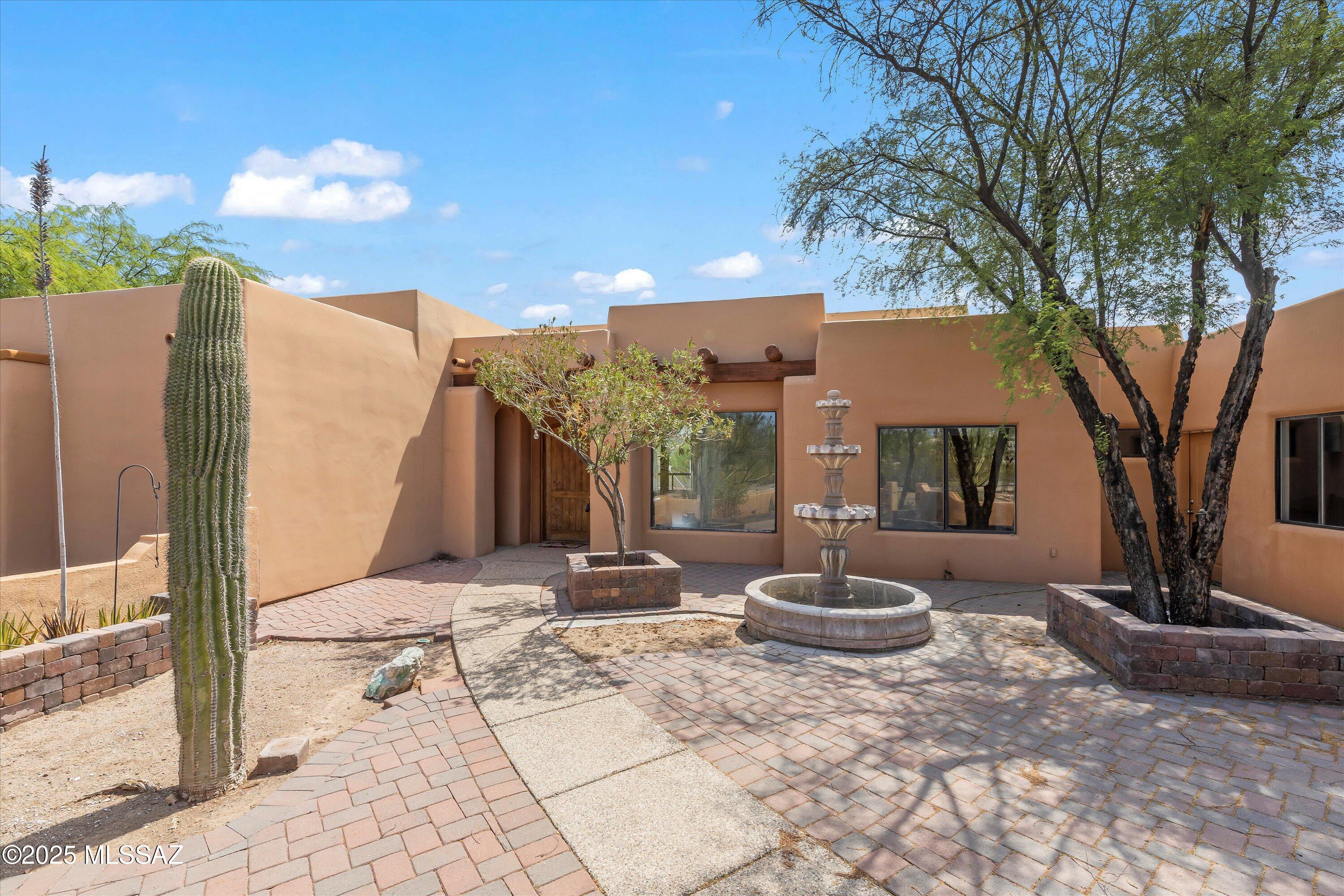 A desert gem. Located on one of the largest lots in the subdivision this home boast 4 bedrooms, 3 bathrooms. A split floorplan with an open concept, high ceilings and large kitchen perfect for entertaining. A welcoming courtyard with a fountain, a large fenced in backyard with a pebble-tec pool and water feature. An added bonus concrete pad with electricity to turn into a basketball or pickleball court and a three car garage. Come take a look, you wont be disappointed.