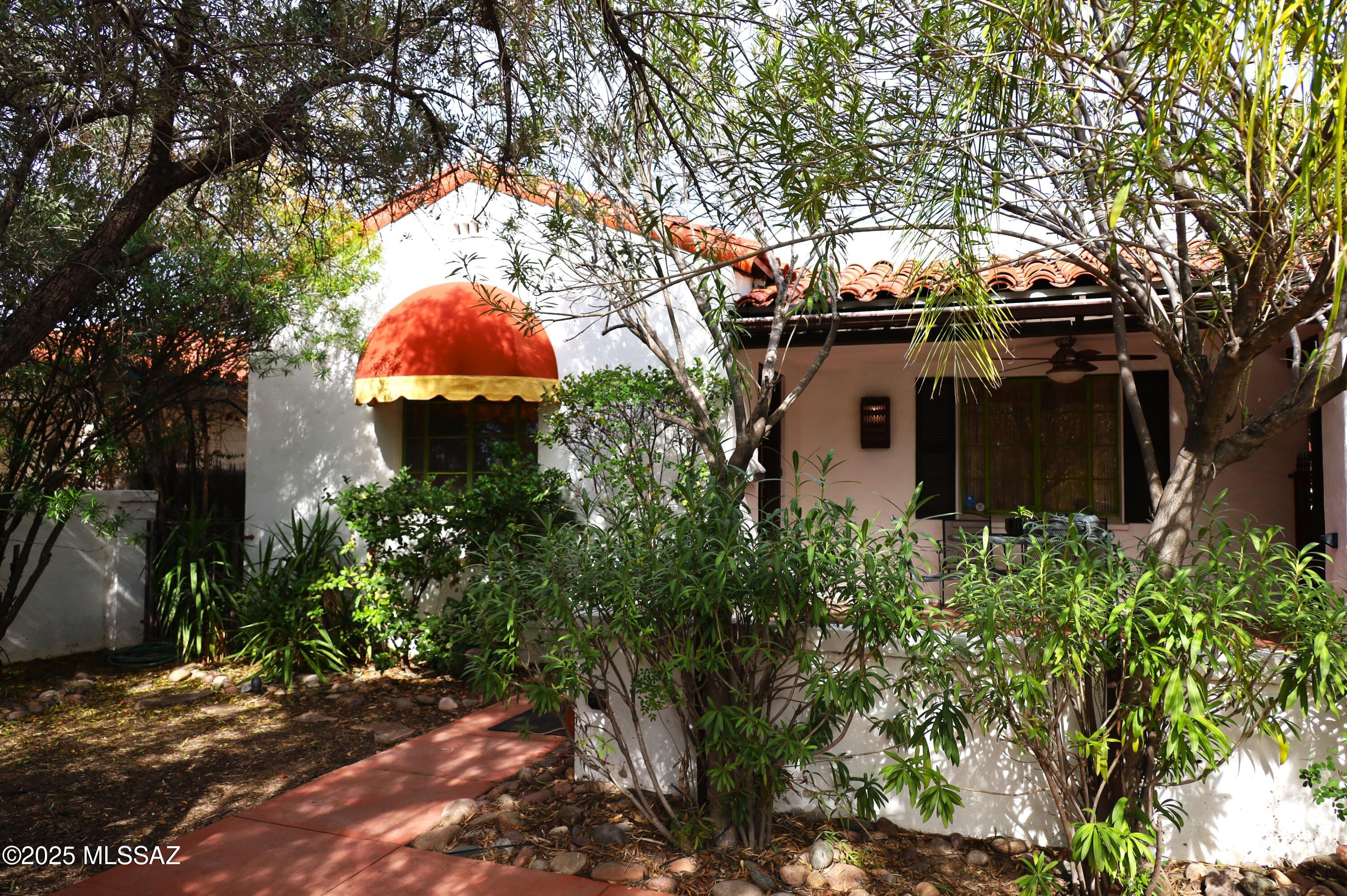 SPACIOUS... 2 bedroom, 1 bath home FULLY FURNISHED / UTILITIES INCLUDED + FREE WIFI! 
Historical Old Pueblo architecture featuring hardwood floors, cove ceilings, starburst picture moulding, and interior saguaro rib shutters.
This home is located in the heart of Sam Hughes neighborhood, within walking distance of UofA campus, numerous dining options and beautiful Himmel Park.
You will find the spacious living room with twin couches, fireplace, and built-in TV and entertainment center a great place to relax. The large main bedroom has a queen bed, triple dresser, desk, and recliner. The second bedroom has a full sized bed, mirrored closet with built in shelves, bookcase, tall dresser and desk for quiet work space.
The oversized bathroom has a built in vanity with drawers a