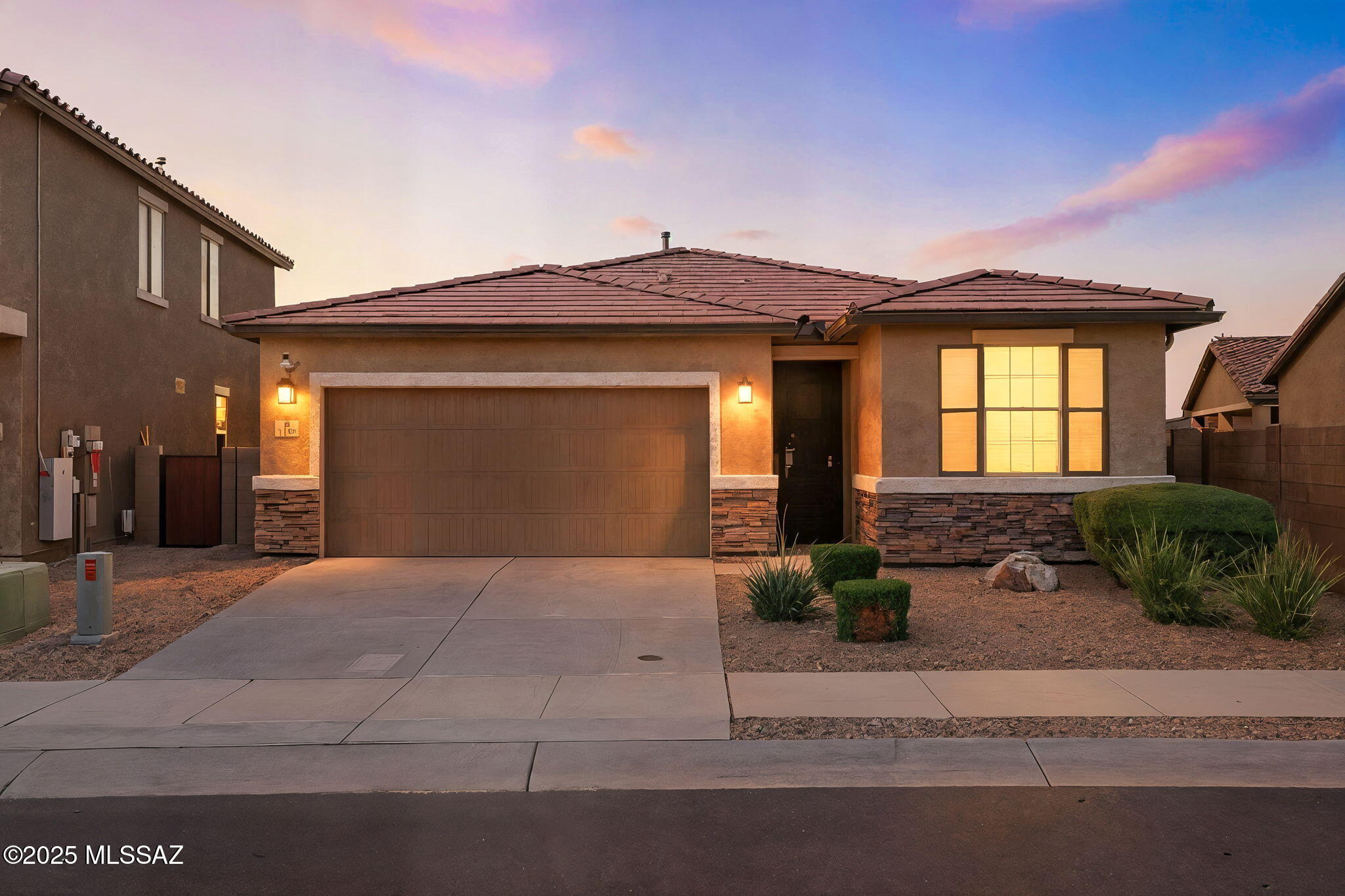 Welcome home to your 3 bedroom + office 2019-built single-story retreat located in the award winning Vail School District, with an assumable 2.99% (3.1% APR) VA loan. The heart of this home is an inviting kitchen with quartz countertops, soft close, gas-range, walk-in pantry and breakfast nook overlooking a spacious great room. The home features three bedrooms, including a beautiful primary suite with oversized walk-in closet and barn door. Upgraded tile runs throughout the kitchen area. Dedicated laundry room with both gas and electric connections. Ceiling fans throughout, and 9' ceilings. The beautifully landscaped extra wide and deep yard is the perfect place to entertain on an Arizona evening, complete with citrus (lime/orange) turf, pavers, gas fire pit, extended patio, putting green green, and more! Your new home was built with all the upgrades inside, and with no direct across neighbors to allow an extended street parking area. Home has been repainted inside and out, solar screens added, gutters added to the front, a metal anti-cut security door, security system with cameras, and small dog security door added too. Slate appliances in the kitchen, an epoxied garage with separate exterior door and water softener loop, outdoor concrete pad for trashcans, and gas stub for BBQ are some the additional thoughtful upgrades to make this feel even more like home.
Located in the highly desirable La Estancia community where you will love the great selection of schools available within the sought after Vail School District. La Estancia has direct access to 'The Loop', an interconnected system of more than 130 miles of paved pathways and bike lanes, two community pools, basketball court, pickleball courts, and more than eight beautiful parks. La Estancia is within close proximity to many major employers, including Davis-Monthan AFB, Tucson International Airport, UA Tech Park, Raytheon and Amazon. Come see your gorgeous new home today!