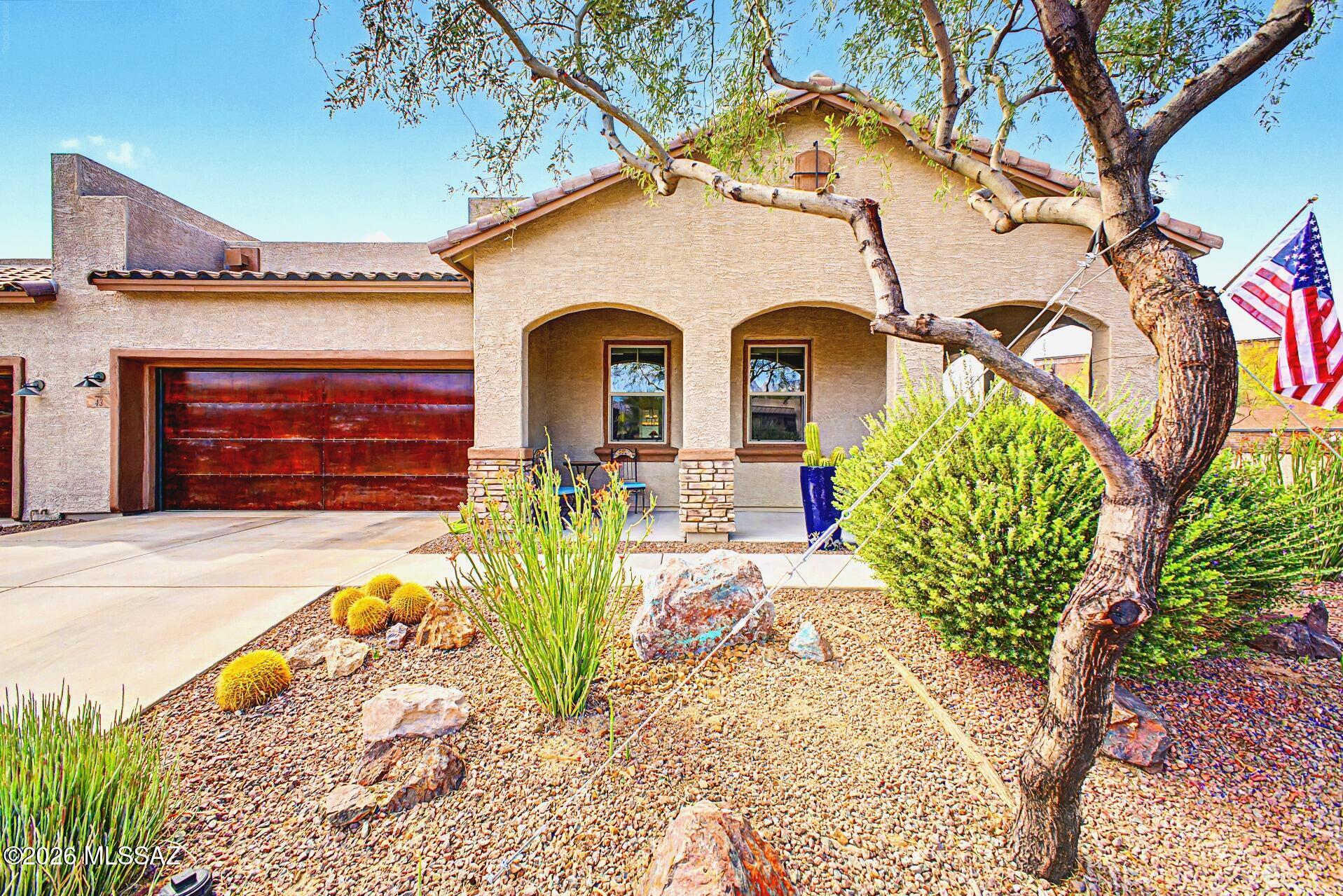 Experience relaxed Arizona living in this stunning end-unit townhome featuring beautiful views of the majestic Catalina Mountains from both the guest bedroom and the private back patio. Designed for comfort and effortless entertaining, this inviting 1,771 sq. ft. great room floor plan offers the perfect blend of luxury and casual elegance.  The thoughtfully designed split-bedroom layout includes 2 spacious bedrooms and 2 bathrooms, providing privacy for both owners and guests. The gourmet kitchen is beautifully appointed with upscale Whirlpool appliances, slab granite countertops, stacked cherry cabinetry with specialty lighting, double roll-out shelves, pendant lighting, & a generous walk-in pantry. Additional highlights of this OWNER/AGENT home include a spacious primary ensuite features luxurious split executive height vanities with slab granite, custom oversized walk-in shower with frameless rain glass enclosure and beautiful tile work, plus a large walk-in closet. At the front of the home is a very comfortable, large guest suite w/ close access to main bath with matching cabinetry, slab granite and shower by the entry door with stacked ledgestone feature wall for separation and guest's privacy.  The home offers ceramic tile flooring throughout, a large laundry room with matching cabinetry, and a convenient drop zone -- all creating a seamless and cohesive living space. Step outside and enjoy true indoor-outdoor Arizona living on the expansive extended paver patio with remote-controlled rolling screens offering added privacy and sun protection. The dining area with sliding glass doors enhances the home's open flow and makes entertaining easy year-round.  The backyard boasts an abundant collection of cacti and low-voltage lighting. This exceptional home in the highly desirable community of Ridgeview at Vistoso Trails combines upscale finishes, breathtaking mountain views, and the relaxed lifestyle you've been looking for.  

This ENERGY STAR home has a HERS rating of 56, with R-30 blown in insulation in attic areas, 50 gal gas water heater, Ecobee Wi-Fi thermostat, Carrier 14-Seer HVAC, with dual pane, Low-E windows and new EcoWater filtration and R/O system. Plus a 2-car garage with rustic newly refurbished metal door, nicely organized with additional cabinetry, overhead and wall storage, utility sink, and color coordinated epoxy flooring. 

Whether you are looking for a fulltime residence, lock-n-leave, or vacation home, this could be it!  This home has been meticulously maintained and loved.  Location is everything and this beautiful home offers close by shopping, casual and fine dining, entertaining, world destination golf, medical and so much more.  You don't want to miss this gem!  Call for your private showing today.  Proudly offered by Owner/Listing Agent.
