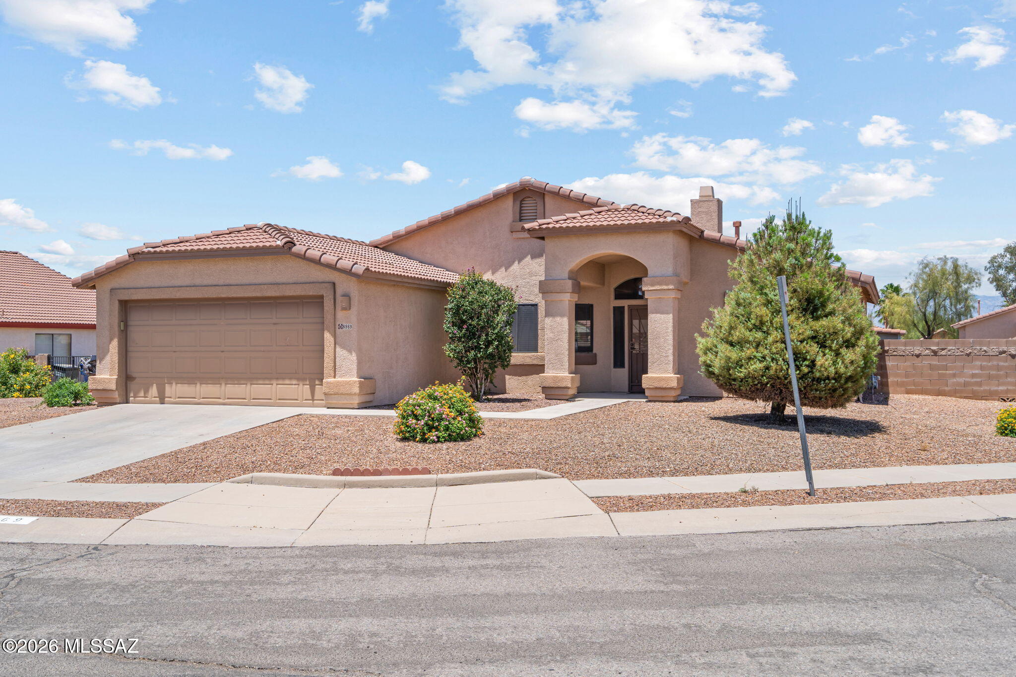 Located in the highly sought-after Rita Ranch community within the acclaimed Vail School District offering multiple high school choices. This move-in ready 3 BR 2 BA charmer on a cul-de-sac lot has it all! Featuring wood-look LVP flooring throughout, newer kitchen appliances, water softener, washer & dryer, and a cozy gas fireplace. Primary BR has a slider to rear yard, double vanity and separate garden tub & shower. Enjoy Arizona living under the huge covered patio overlooking a beautifully landscaped backyard with decorative gravel, turf, mature trees, and double gate entry to the rear yard. Convenient to shopping & dining at the Mary Ann Cleveland center & shopping plazas on Nexus & Rita Ranch blvd & Public pool @ Purple heart Park. Convenient to I-10 & major employers DMAFB, Amazon
