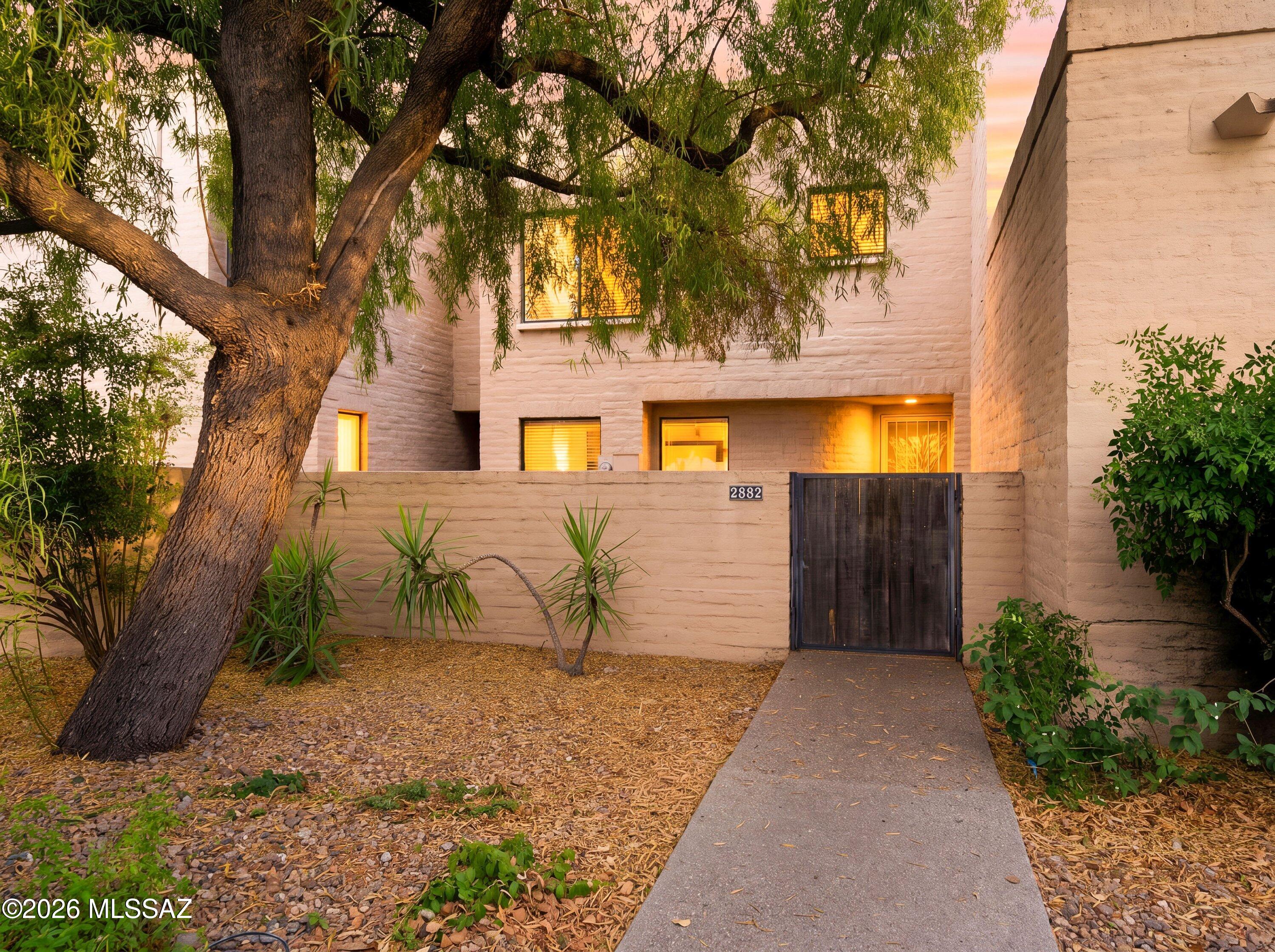 Located in the Tamarisk townhome community near the iconic Tucson Racquet Club, this 1,503 sq ft home includes 2 bedrooms, 2.5 bathrooms, and a practical floor plan in a convenient central Tucson location. New carpet has been installed throughout, the roof has been recently repaired and coated, and the HVAC system has been recently serviced. The primary suite features a wood-burning fireplace, and the second bedroom has it's own en-suite bathroom. A second wood-burning fireplace is located in the living room. The kitchen has the most charming breakfast nook.  Storage is found throughout the home, along with a private front courtyard and rear patio. Residents also enjoy the recently resurfaced community pool and spa.