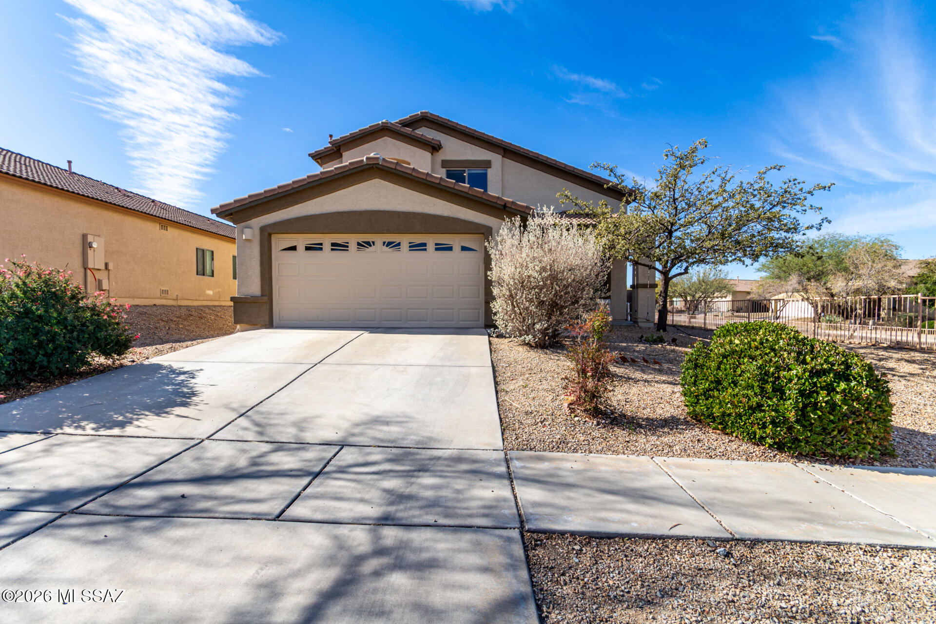 The search is finally over! This corner lot property welcomes you with a 2-car garage and a front patio that sets an inviting tone. Fall in love with the spacious living/dining room with soaring vaulted ceilings, abundant natural light, and durable tile flooring. Gather loved ones in the great room, perfect for intimate evenings. The stunning kitchen comes with neutral toned counters, ample wood cabinetry with crown moulding, recessed lighting, built-in appliances, a handy pantry, and a two-tier island with a breakfast bar. The tranquil main bedroom features soft carpeting, an ensuite with double sinks, and a walk-in closet. Enjoy peaceful afternoons in the lovely backyard, which offers a covered patio with surround sound, stylish pavers, and plenty of space for outdoor activities.