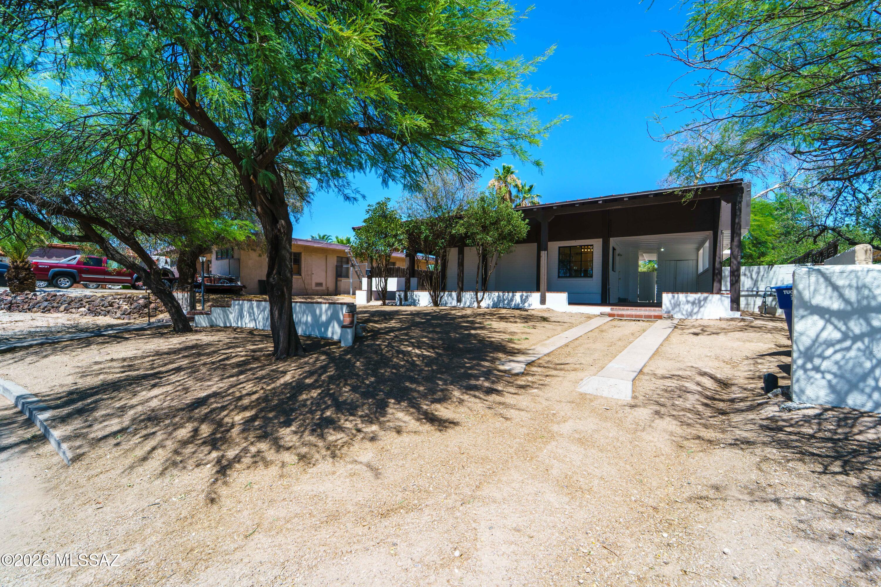 Super cute 2bd/1bath in historic Sam Hughes. Amazing opportunity to get into one of Tucson's classic neighborhoods.  Plenty of character, beamed ceilings and lots of light throughout. Two covered patios including a large covered back patio offers out door living as well as a huge yard to make your own.  Comfortable city desert living with possibilities to add on or update to your liking. This home is ideally situated near the University of Arizona, Downtown Tucson, and the revitalized Rancho Center, home to Whole Foods Market. Nearby amenities along the Sunshine Mile include Natural Grocers, Trader Joe's, along with a growing collection of local restaurants, cafés, and neighborhood businesses. This home is ideally situated near the University of Arizona, Downtown Tucson, and the revitalized Rancho Center, home to Whole Foods Market. Nearby amenities along the Sunshine Mile include Natural Grocers, Trader Joe's, along with a growing collection of local restaurants, cafés, and neighborhood businesses. Historic character, modern livability, and one of central Tucson's most connected locations come together in this classic Tucson home.