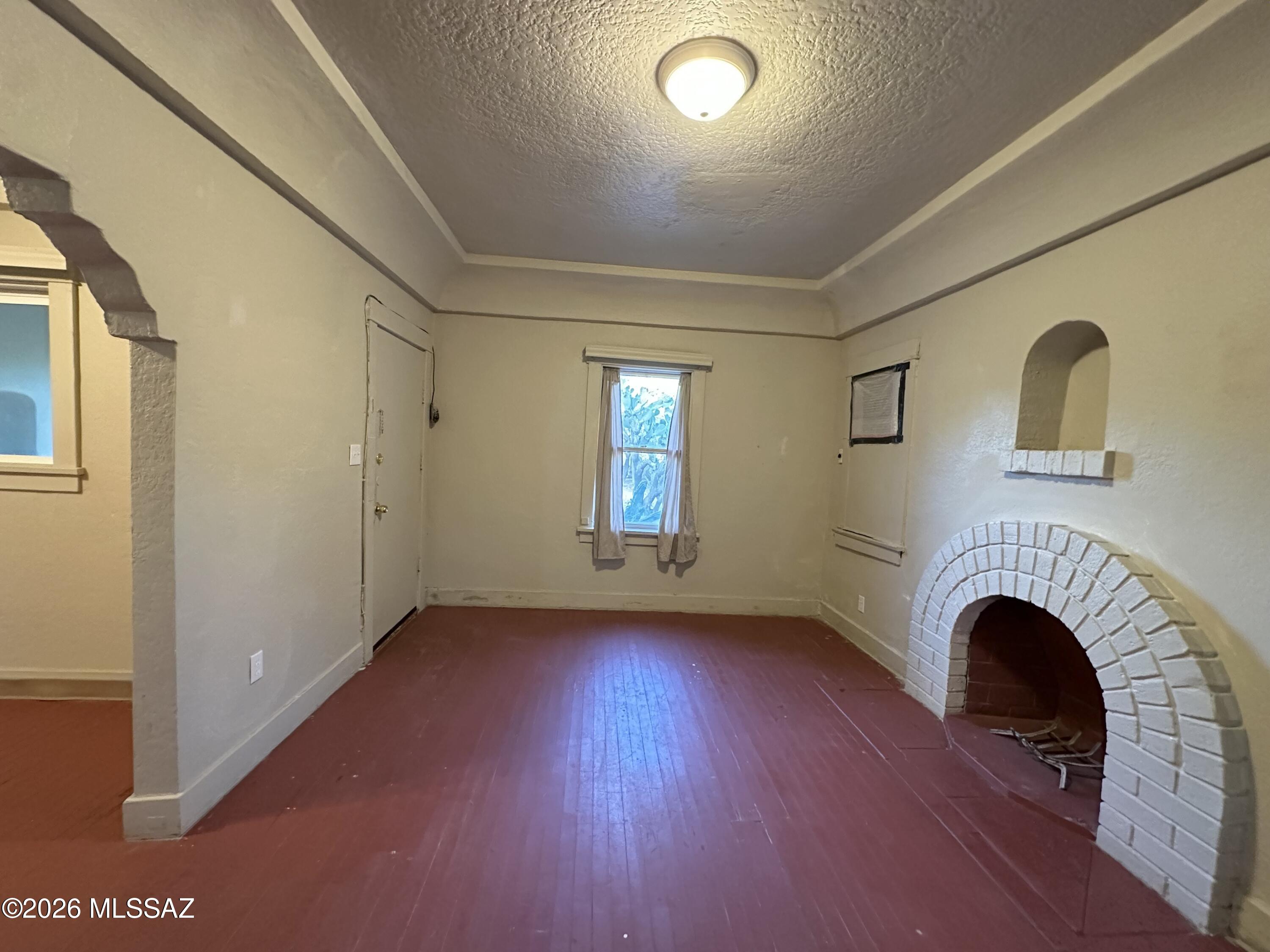 Great opportunity to own a character-filled Southwestern/Territorial duplex in the heart of Tucson! Authentic vintage charm, showcasing arched architectural details, Saltillo tile, built-in cabinetry, plaster walls, wood floors, decorative niches, & classic wood burning fireplace that captures true Tucson character.
Each unit offers its own distinct charm, functional layout & spacious living areas. The property blends historic Southwestern style with solid income potential, making it ideal for investors, owner-occupants, or those seeking a unique multi-generational setup.
Situated on a large lot with mature desert vegetation & right across the street from small neighborhood park, this duplex offers convenient access to downtown Tucson, the UofA area, shopping, dining, and local amenities