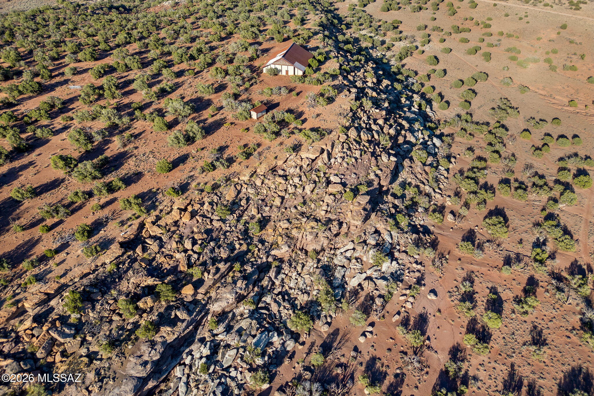 Get away from it all at ~6000' elevation in Last Mesa Ranch in the White Mountains. 77 acres (2 38.5 acre parcels) of wide open space where you can bring your toys for weekend fun, or build your private off grid mountain retreat. Massive garage/shop('10,000sq ft) and a registered private well already in place.  Interesting property with north part on a mesa with views for miles. Seasonal wash on easterly portion. 
No HOA. No neighbors.  No noise. No limits.  
GPS coordinates: 34.472380°, -109.805338°