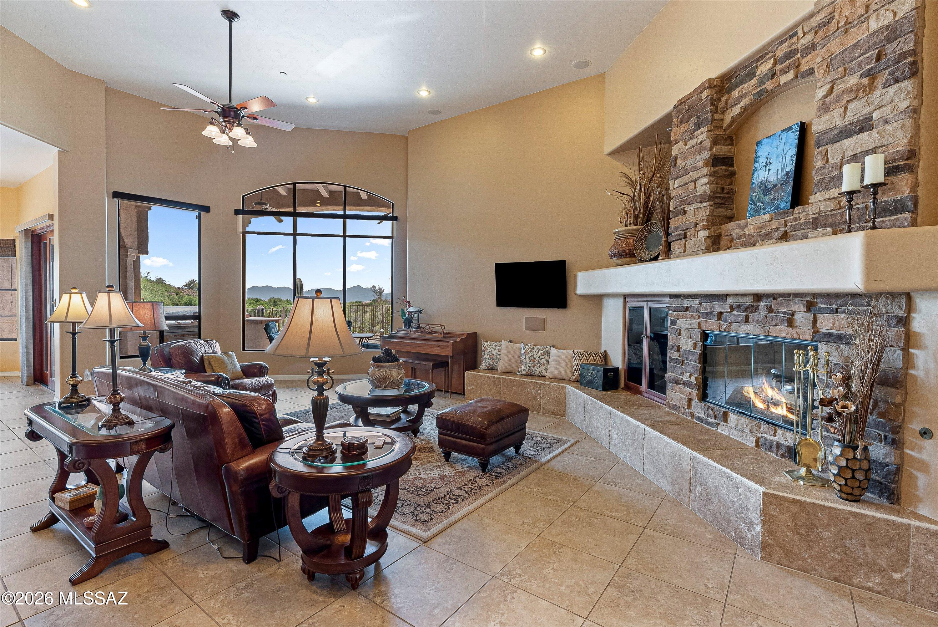 First time on the market, this luxury residence is perfectly positioned on the largest lot in the community, offering unmatched privacy and stunning views of the mountains, city lights, and golf course. You will find an extremely large office with exterior access for your home business. The home features a split floor plan with towering ceilings and an open, airy layout filled with natural light. Step outside to your own private retreat, an expansive patio ideal for entertaining or relaxing in complete seclusion, complemented by a sparkling pool and terraced landscaping. Additional highlights include a abundant storage including a spacious 3-car garage with sleek epoxy flooring and an enormous walk up storage area above the garage.  Close to dining, top  schools and outdoor activities.