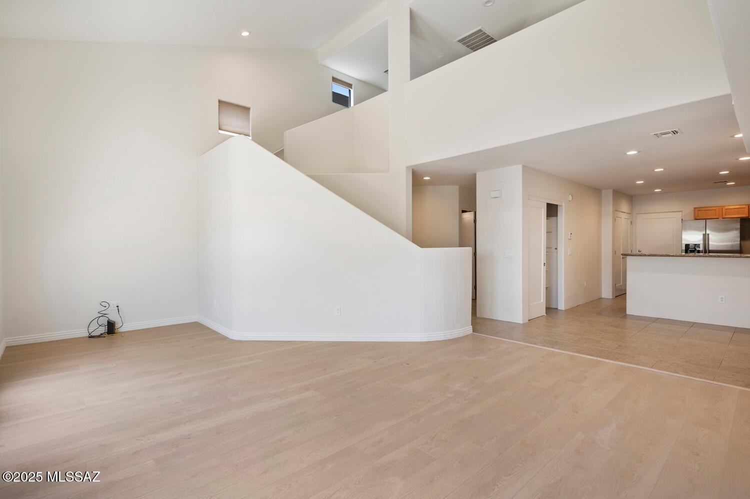 Entire property has been recently remodeled with new flooring and fresh paint. This well-maintained, modern townhouse-style Townhouse offers an ideal blend of contemporary finishes and practical living. With vaulted ceilings, granite-accented kitchen, upstairs loft and flexible spaces, plus a balcony with views, it suits professionals, grad students, or faculty. It's within walking distance to U of A, medical centers, restaurants, and the Loop--a low-maintenance, lifestyle-focused home in a vibrant neighborhood.