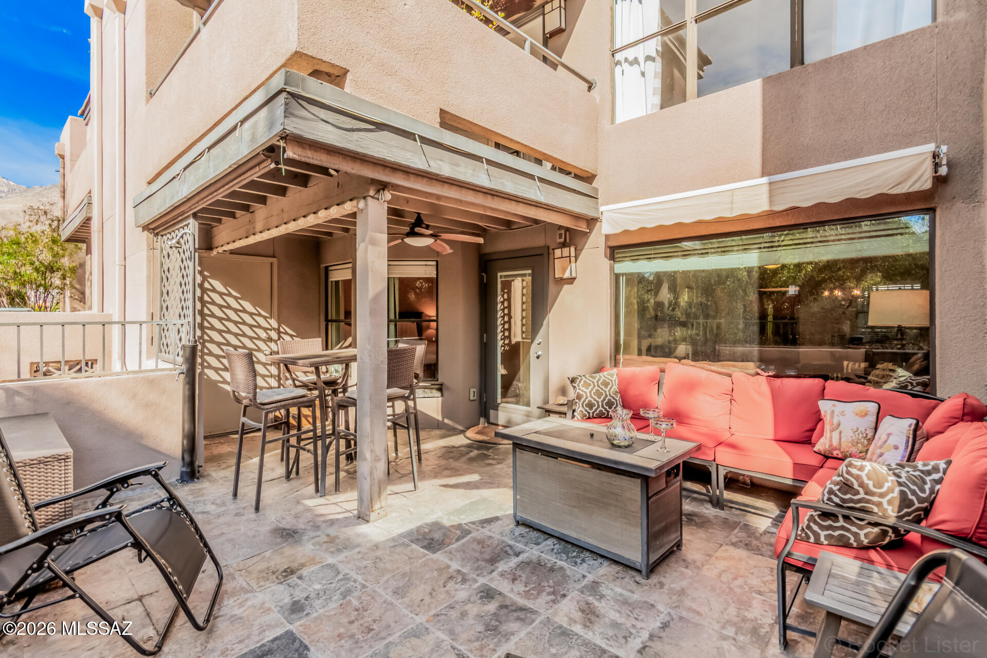 Beautifully designed condominium with a rare extended patio and mountain views, perfectly situated in the sought-after Greens at Ventana Canyon. This inviting home showcases elegant tile flooring throughout, a custom-finished fireplace, and a stylish kitchen complete with granite countertops, custom backsplash, and sleek stainless steel appliances. The spacious primary bedroom offers an en suite bathroom with a granite countertop and beautifully tiled shower. A high-end stackable washer and dryer add convenience, making this residence ideal for both year-round living and a lock-and-leave lifestyle. Step outside to the stunning extended patio featuring a covered seating area, roll-out awning, and picturesque Catalina Mountain views, perfect for relaxing or entertaining.  Enjoy close proximity to the golf course and pool!   Residents of the Greens enjoy an active community lifestyle with access to three heated pools, two spas, a fitness center, and clubhouse, all set within the prestigious Ventana Canyon area of the Catalina Foothills, just minutes from shopping, fine dining, golf, hiking, and cycling.