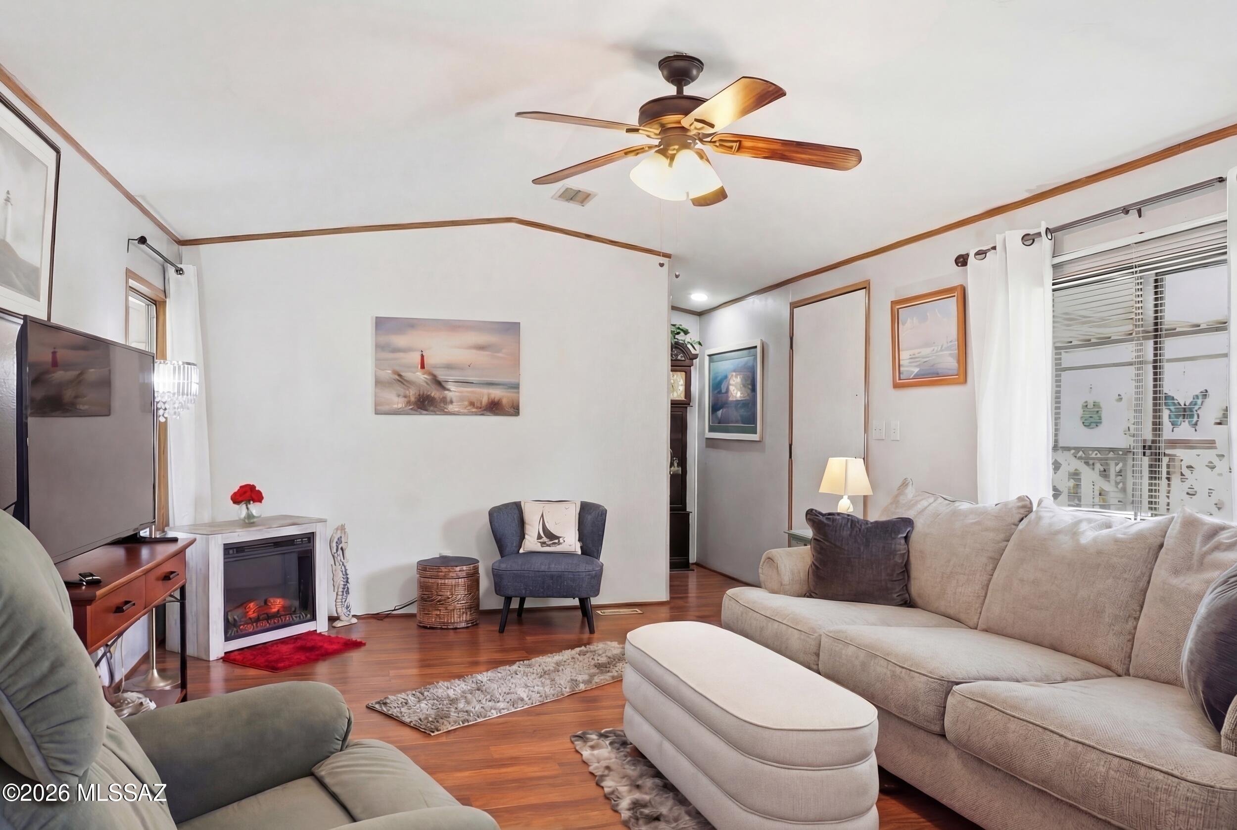 FINANCING AVAILABLE! Located on leased land in the desirable Tucson Meadows 55+ community, this beautifully maintained 1999 manufactured home offers 2 bedrooms, 2 bathrooms, a split floor plan, and a BRAND-NEW A/C for year-round comfort. Relax on the private balcony with mountain views, enjoy the convenience of a spacious laundry room, a shaded 3-car carport, and a fenced dog run. Tucson Meadows offers an exceptional active-adult lifestyle with a heated pool and spa, clubhouse, fitness center, saunas, game room, picnic areas, private walking and biking streets, RV storage, and access to Rolling Hills Golf Course amenities. A wonderful opportunity to enjoy comfort, community, and convenience! Welcome to your Tucson Home!