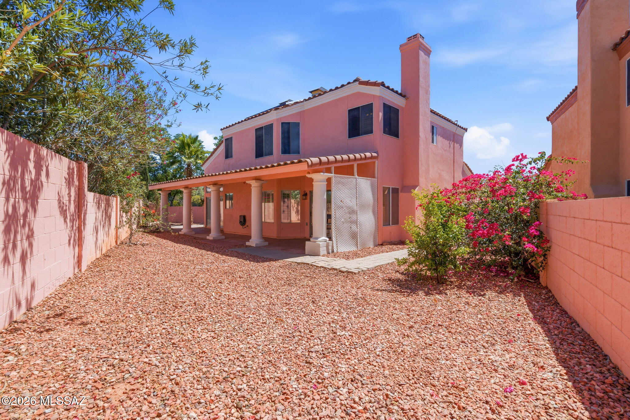 Stunning 4-bedroom home with first-floor office/den on a quiet cul-de-sac in sought-after North Ranch! Nothing to do but move in. This ~2,600 sq ft home has been thoughtfully updated and is truly turnkey. The first-floor office/den features elegant French doors and custom built-in industrial shelving, perfect for working from home. Enjoy engineered wood floors and LVT (NO CARPET), granite counters, freshly updated cabinets, plantation shutters throughout, brand new exterior paint, solar panels, and a custom wrought iron front gate. This desirable, established North Ranch neighborhood includes community pools, tennis, basketball and volleyball courts, and a playground, all just minutes from Oro Valley shopping, dining and golf. Truly a must-see!