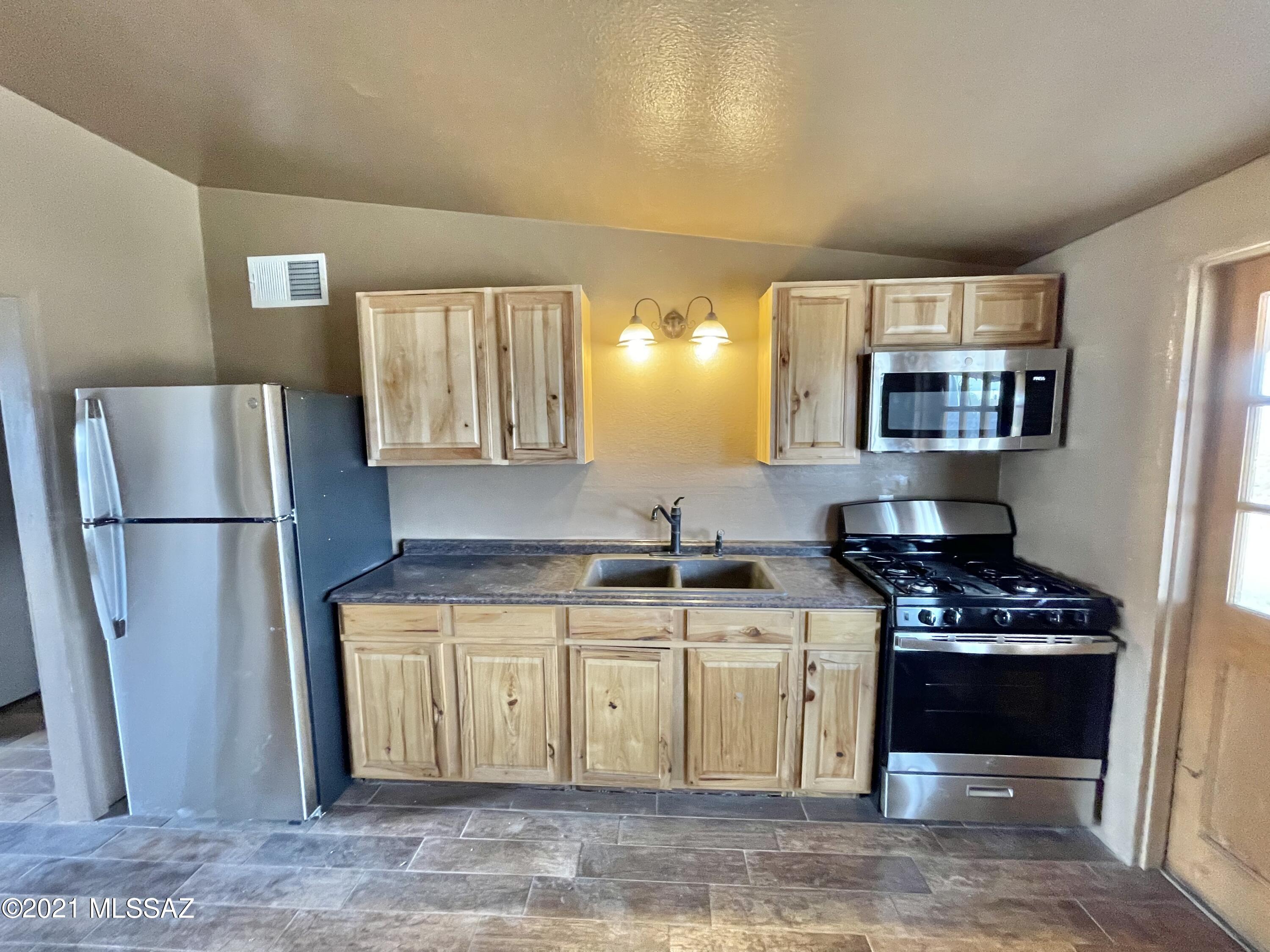 Completely remodeled 2 bed / 1 bath home with many upgrades, including central AC system, updated kitchen with custom cabinets and appliances (fridge and gas range). Vacant and available for move-in right now! Tile flooring in living areas and bathroom, with carpet in bedrooms. Backyard features incredible mountain views and privacy fencing. Covered carport for parking. Please contact property manager with property address and your email for application and to schedule a showing.