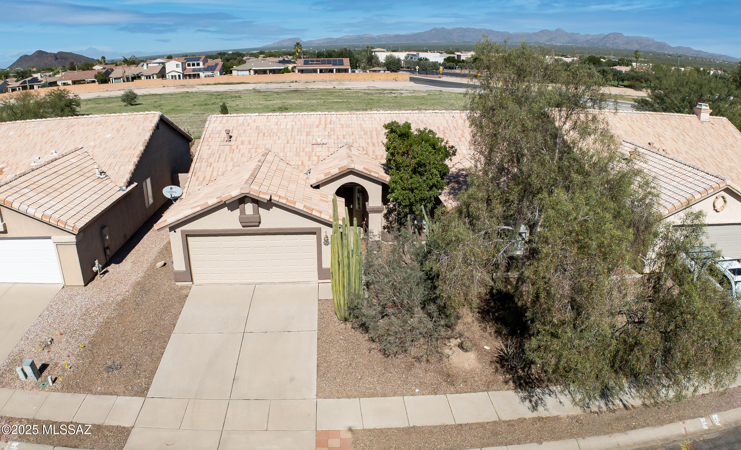 Welcome to this beautiful 4-bedroom, 2-bath home in the highly sought-after Continental Ranch community! This well-designed floor plan offers an inviting open concept with vaulted ceilings, a spacious great room with modern built in bookshelves, dining area, and breakfast bar, perfect for entertaining or relaxing! The large primary suite features dual sinks, a walk-in shower with built-in bench, and generous closet space. Enjoy white shutters throughout, good-sized secondary bedrooms, and an abundance of natural light throughout the home.

Step outside to a fully landscaped backyard with stunning mountain views, ideal for evening gatherings or quiet mornings. All appliances convey, and the home includes a two-car garage with extra storage space in the garage for added convenience. Take advantage of Continental Ranch amenities including pools, activity centers, walking paths, and more, all within the Marana School District. Conveniently located near restaurants, grocery stores, and with easy access to I-10 for a quick commute anywhere in Tucson! VA Assumption Possible - 4.125% for VA Buyers!
