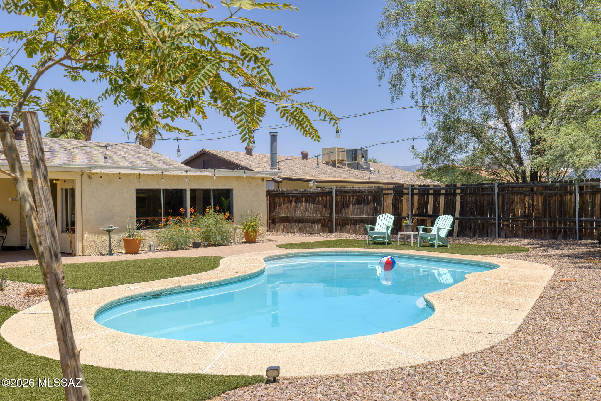 Why choose between a move-in ready home and a backyard you'll actually use? Here, you get both!
Set on nearly a quarter-acre lot with no rear neighbors, this Northwest Tucson home offers the privacy, outdoor space, and amenities you've been looking for. The backyard is the highlight, fully landscaped, a refreshing pool, an expansive covered patio, and plenty of room to entertain or relax. The Arizona room provides valuable flex space and opens directly to the backyard, creating seamless indoor-outdoor living. Inside, you'll find a functional floor plan with 3 bedrooms and 2 bathrooms, fresh interior paint, ceramic tile throughout the main living areas, and new carpet in the bedrooms. AND a new roof adds peace of mind and value. Conveniently located near shopping, dining, and everyday amenities, this move-in ready Northwest Tucson home combines privacy, space, and updates that are increasingly hard to find. If a great backyard tops your wish list, this home is one you won't want to miss.
