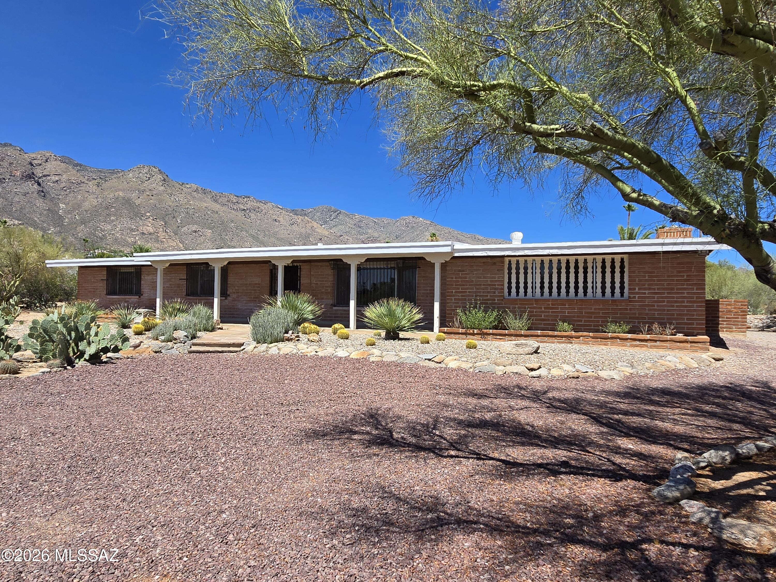 Breathtaking mountain views! This 4 bedroom, 2.5 bathroom home is nestled in a cul-de-sac in the sought-after Skyline Bel Air Estates in the Catalina Foothills. With plenty of comfortable living space, this home features a formal living room and dining room, along with a warm and inviting family room complete with built-in cabinets and a wood burning fireplace. The expansive covered patio is the perfect space for enjoying the breath taking mountain views, making this home a true Foothills gem!  ALL ITEMS IN GARAGE TO REMOVED BEFORE CLOSING.