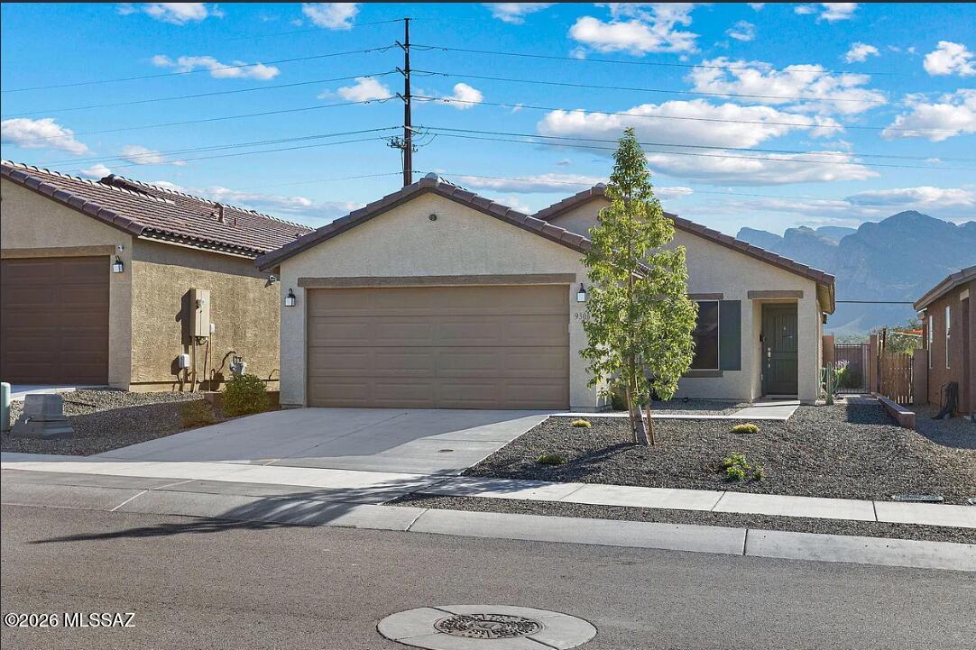 Beautiful 3BR/2BA Home with Mountain Views in Northwest Tucson! This meticulously maintained home offers the perfect blend of comfort, style, and functionality. Featuring an open-concept great room with ceramic tile flooring, it's ideal for both everyday living and entertaining. The upgraded kitchen boasts granite countertops, a large center island, walk-in pantry, and custom cabinet pull-outs for exceptional storage and organization. Enjoy modern fixtures throughout, plus the convenience of a water softener and reverse osmosis system. The spacious backyard is perfect for relaxing or hosting guests while taking in beautiful mountain views. Located in desirable Northwest Tucson near shopping, dining, parks, and outdoor recreation. A must-see rental opportunity!