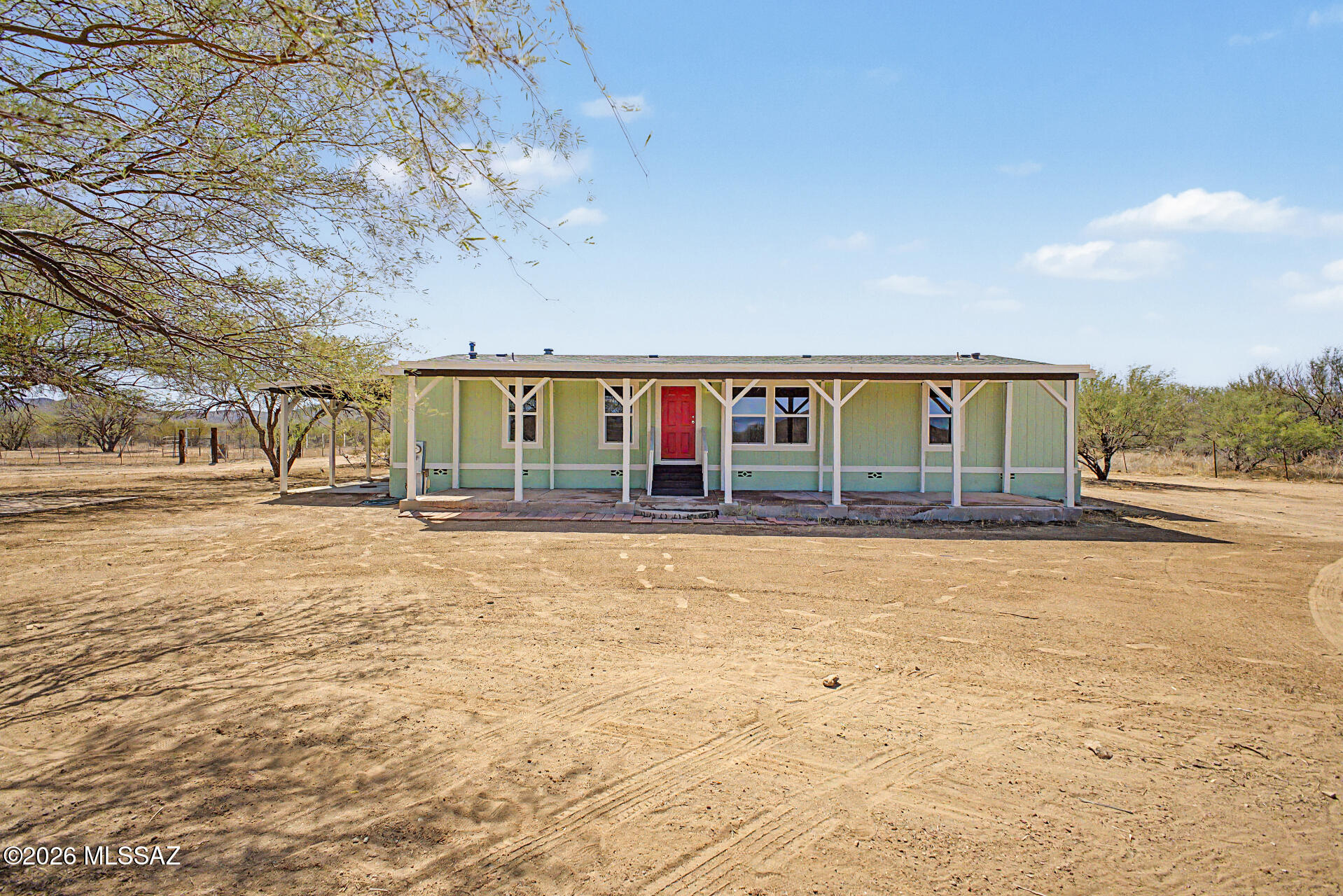 Seller to accept or counter offers between $279,900-$289,900. Experience the charm of country living with the peace of mind of a complete remodel! This stunning farmhouse sits on just under 5 acres, offering a blank canvas for your dream homestead, equestrian lifestyle, or endless room for ATVs, RVs, and other power toys. Thoughtfully updated with stylish finishes throughout, including a new A/C unit to keep you cool through Tucson's summer heat while helping reduce utility costs. The horse facilities make it easy to bring your animals home, while the inviting front porch is the perfect place to enjoy breathtaking Arizona sunrises and colorful sunsets. A rare opportunity to create the lifestyle you've been dreaming of!