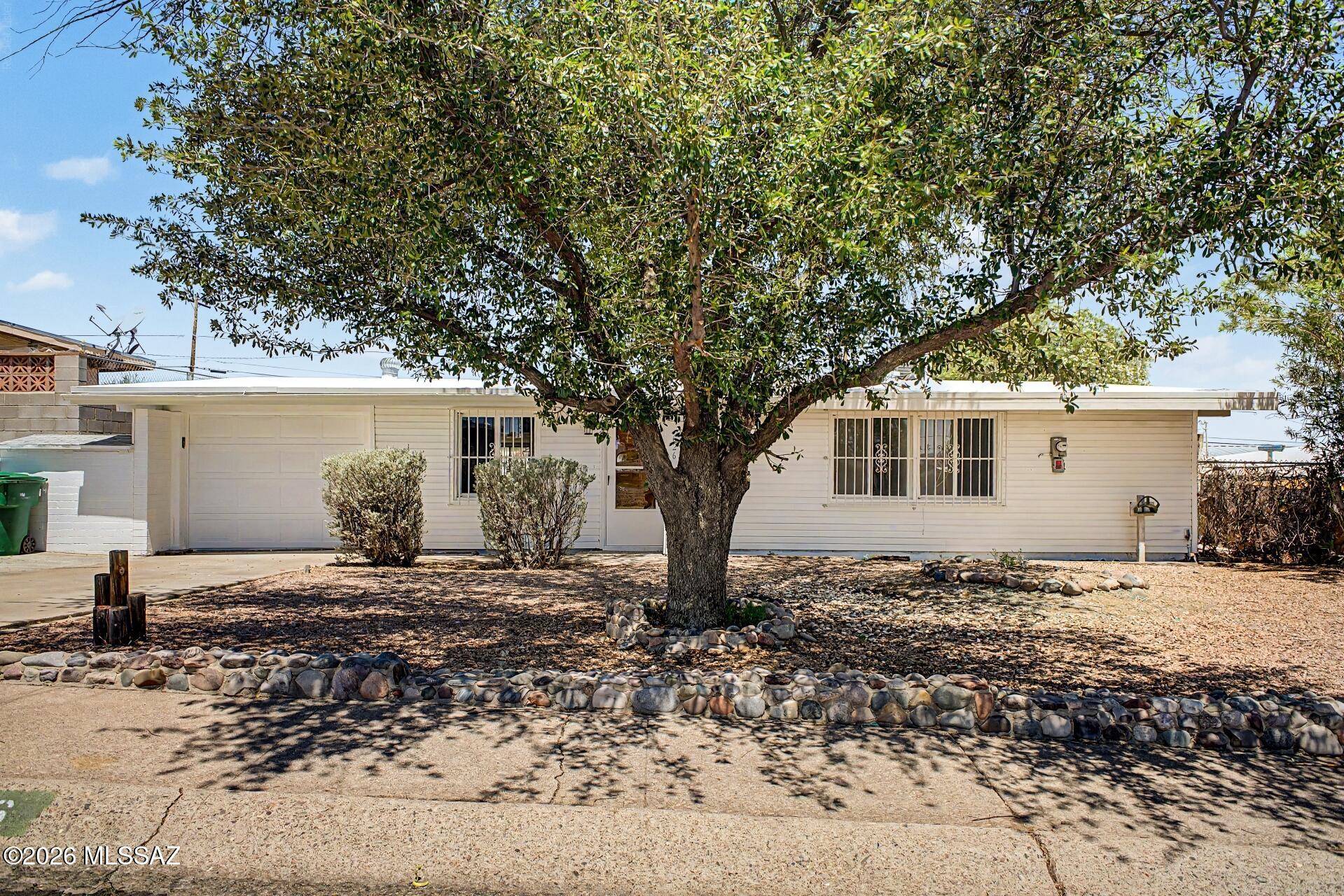Fantastic opportunity to own this charming single-level home! Backing to untouched desert open space with no rear neighbors, this home offers fantastic views and added privacy. Providing 3 bedrooms, 2 bathrooms, and a 1-car garage, the interior showcases vaulted ceilings, natural light, a neutral palette, and carpet and tile flooring throughout. The functional layout features a desirable great room and a separate family room with a freestanding wood stove. The kitchen boasts ample wood cabinetry and a breakfast bar. Perfectly sized bedrooms include a main bedroom with a full bathroom. Check out the spacious backyard with a covered patio, storage shed, and workshop! New HVAC and roof! With room to add your own style, this home offers exciting potential you won't want to miss. Agent/Owner!