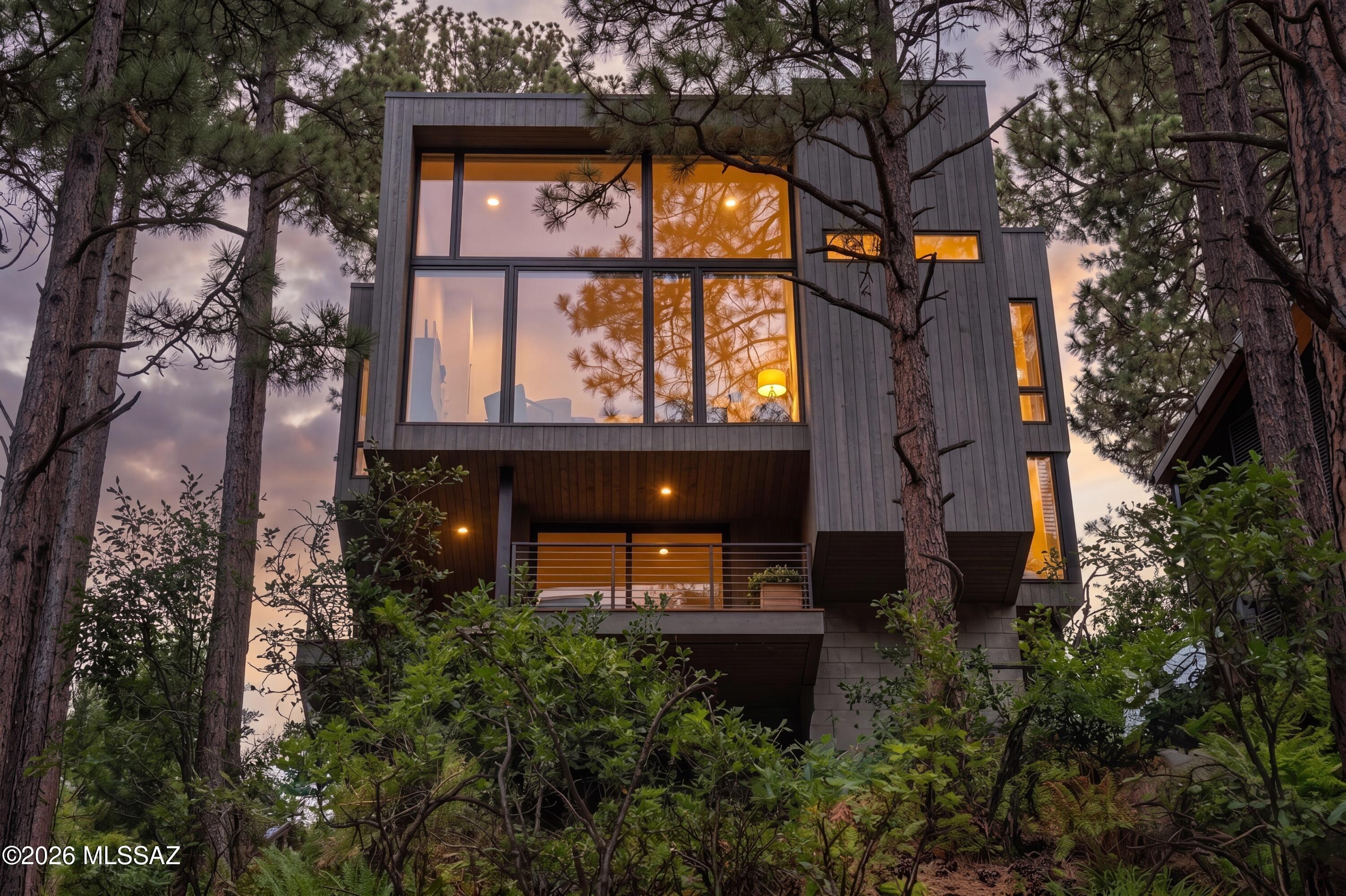 The Cubist — designed by award-winning architect Kevin B. Howard — takes Mt. Lemmon and Summerhaven real estate to the next level and beyond. This architectural masterpiece showcases uncompromising design, exceptional quality, and the finest finishes, appliances, and fixtures.
Perfectly positioned to capture spectacular Mt. Lemmon and lush forest views, this three-story modern ''Glass Treehouse'' redefines the standard for a summer retreat in Southern Arizona. Every detail reflects a commitment to luxury, innovation, and harmony with the natural surroundings. Located in the heart of Summerhaven, this remarkable property is easy to preview, with the exclusive opportunity to meet directly with the architect/builder to fully appreciate the vision and craftsmanship of this one-of-a-kind h