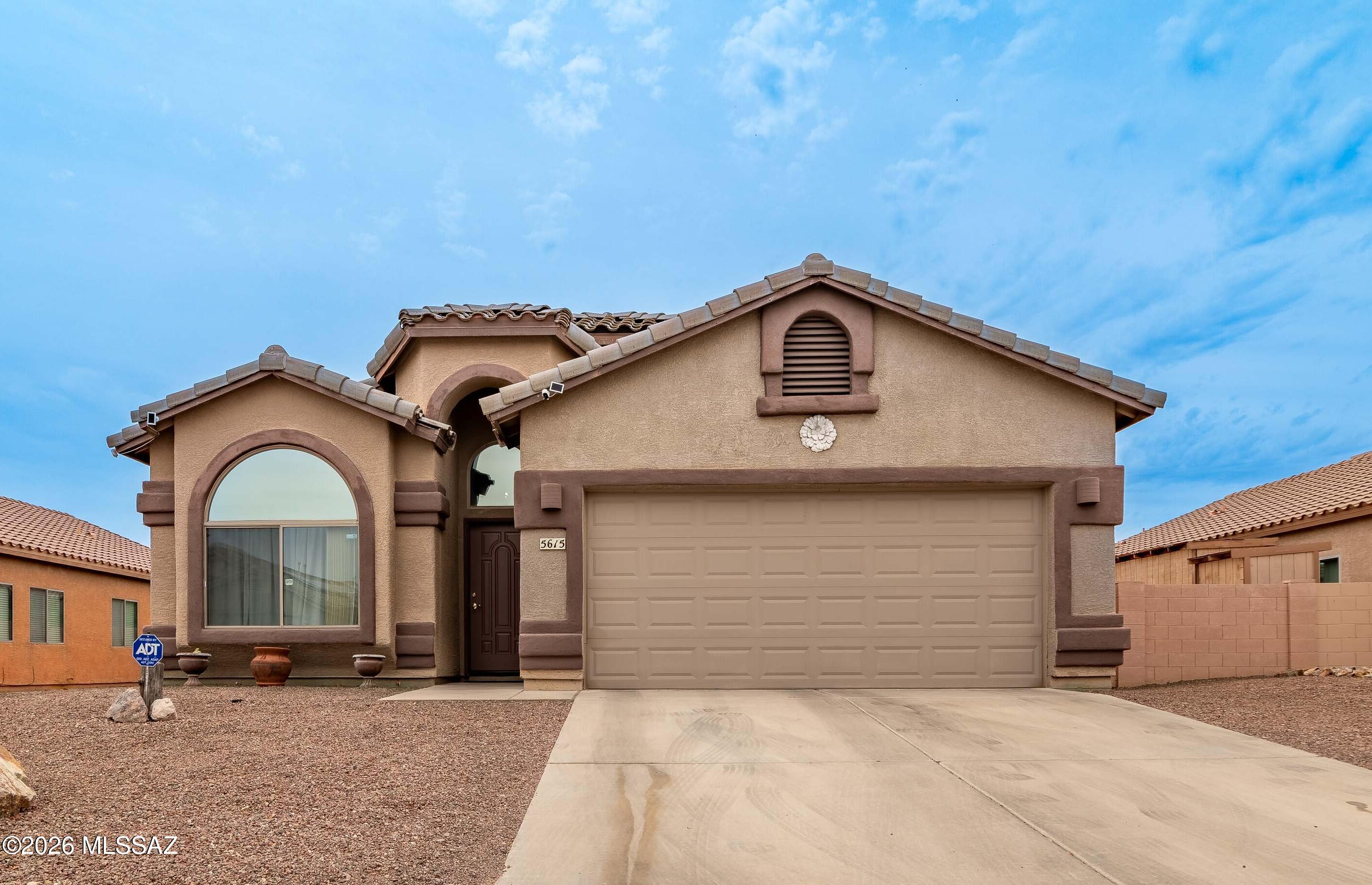 Spacious and inviting 4-bedroom, 2-bath home located in the desirable Cortaro Ranch community. This well-designed floor plan offers comfortable living with ample natural light and functional spaces throughout. The extended-depth garage provides extra room for storage, hobbies, or larger vehicles. Step outside to enjoy the covered back patio--perfect for relaxing, entertaining, or enjoying Arizona evenings year-round. Conveniently located near parks, shopping, and dining, this home offers both comfort and convenience. A must-see!