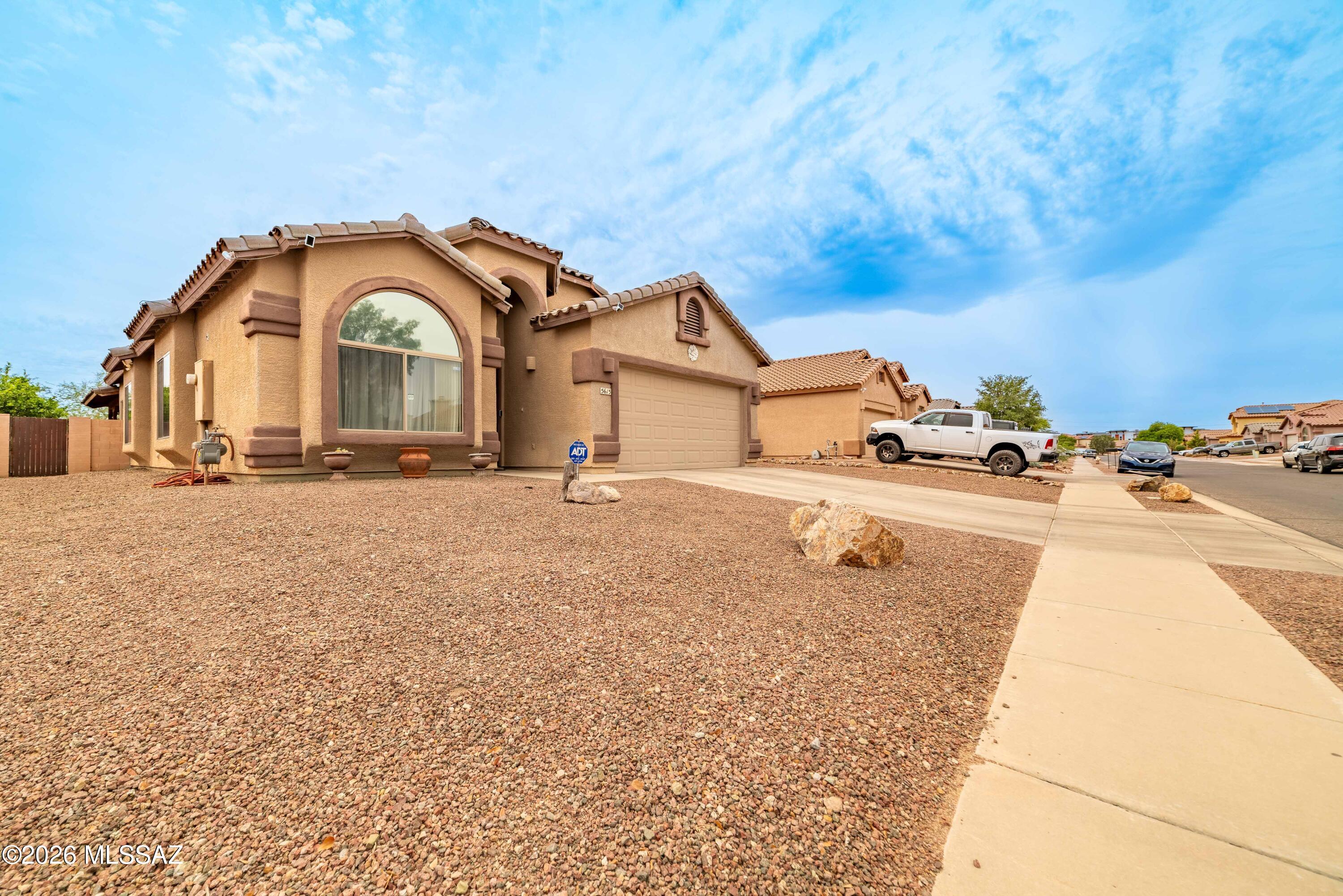 Spacious and inviting 4-bedroom, 2-bath home located in the desirable Cortaro Ranch community. This well-designed floor plan offers comfortable living with ample natural light and functional spaces throughout. The extended-depth garage provides extra room for storage, hobbies, or larger vehicles. Step outside to enjoy the covered back patio--perfect for relaxing, entertaining, or enjoying Arizona evenings year-round. Conveniently located near parks, shopping, and dining, this home offers both comfort and convenience. A must-see!