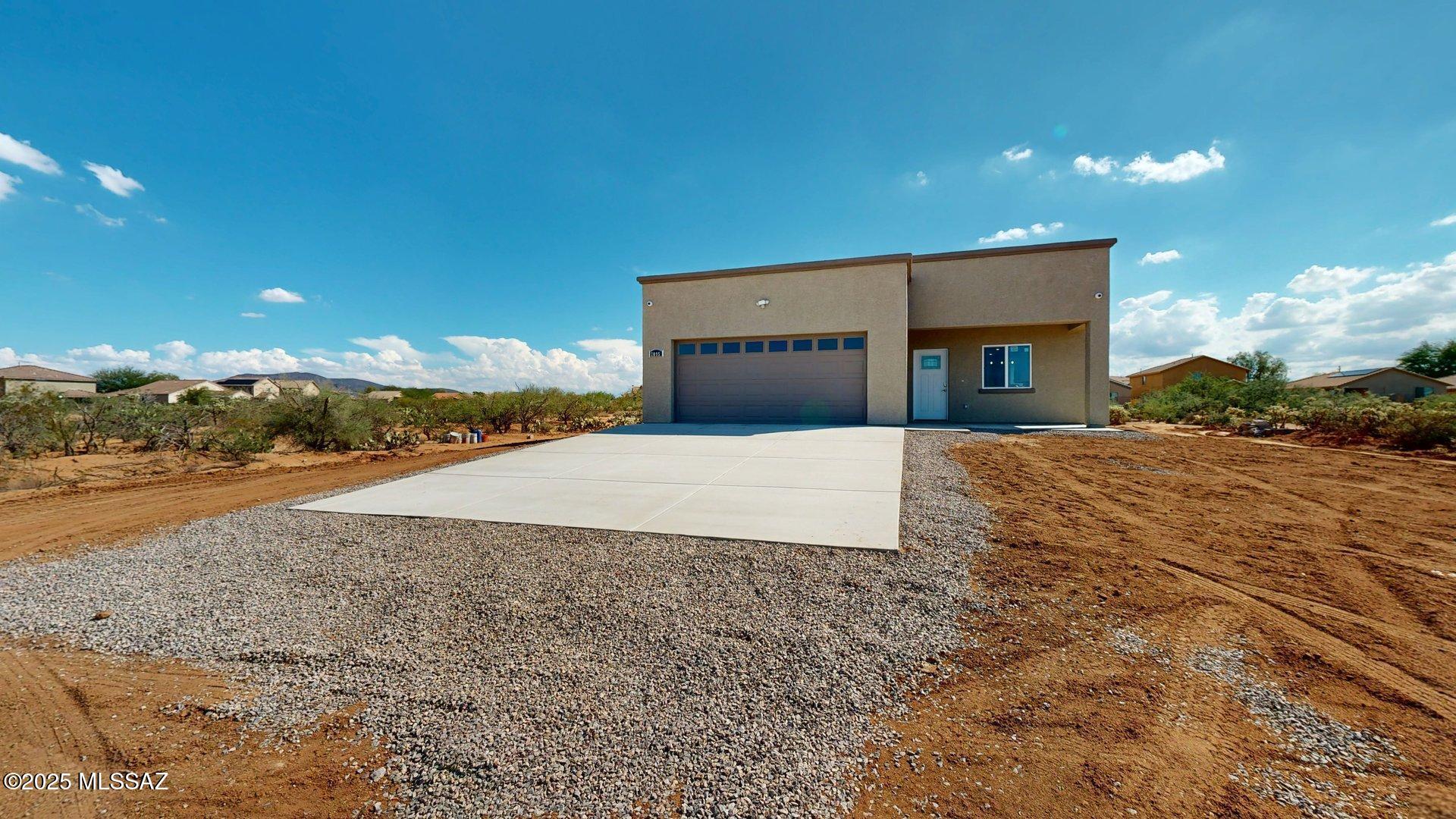 Discover this stunning, brand-new construction Santa Fe-style home, perfectly nestled on a spacious and private 2-acre lot. Offering 1,570 square feet of thoughtfully designed living space, this 3-bedroom, 2-bathroom residence blends modern comfort with timeless Southwestern charm.
Step inside to beautiful ceramic tile flooring throughout and elegant marble countertops in the kitchen that create a bright, clean, and luxurious feel. The open layout is ideal for both relaxing and entertaining, while the generously sized bedrooms provide ample space and privacy. Outside, enjoy the peace and seclusion of your expansive 2-acre property -- plenty of room for toys, work equipment, RVs, boats, or simply enjoying the outdoors. The private setting offers a rare sense of tranquility.