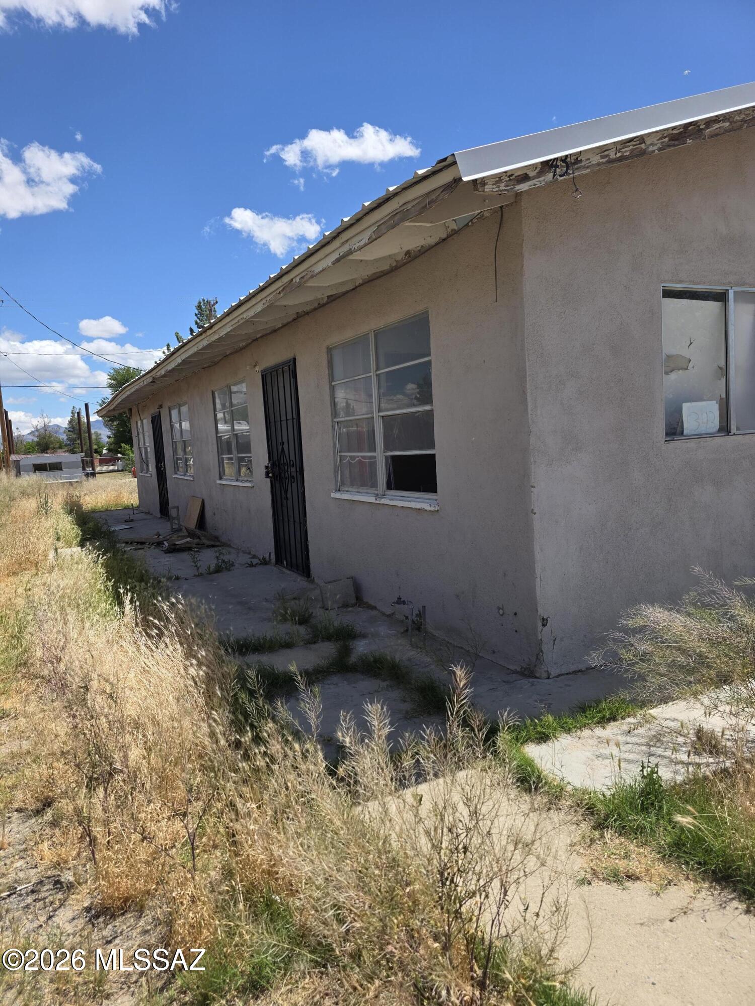Duplex partially finished and in need of repairs. Currently vacant. Close to schools and shopping. Potential for extra income.