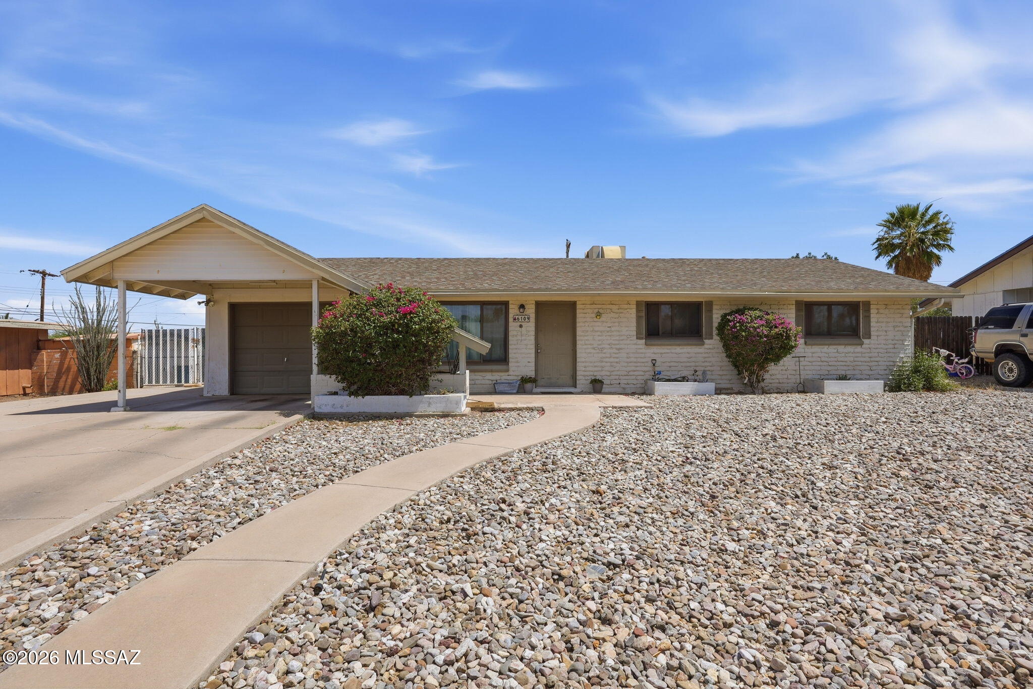 Opportunity awaits in this spacious 3-bedroom, 2-bath home offering approximately 1,880 square feet of living space in a desirable Tucson location. Featuring a large family room with a cozy fireplace, generous living spaces, and a functional floor plan, this home offers plenty of room to make it your own. Outside, you'll find a private backyard complete with a pool and ample space for entertaining, relaxing, or bringing your vision to life. An extended driveway and garage provide plenty of parking and storage. Conveniently located near shopping, dining, schools, parks, and everyday amenities. Competitively priced for the area, this property offers an excellent combination of size, location, and value.