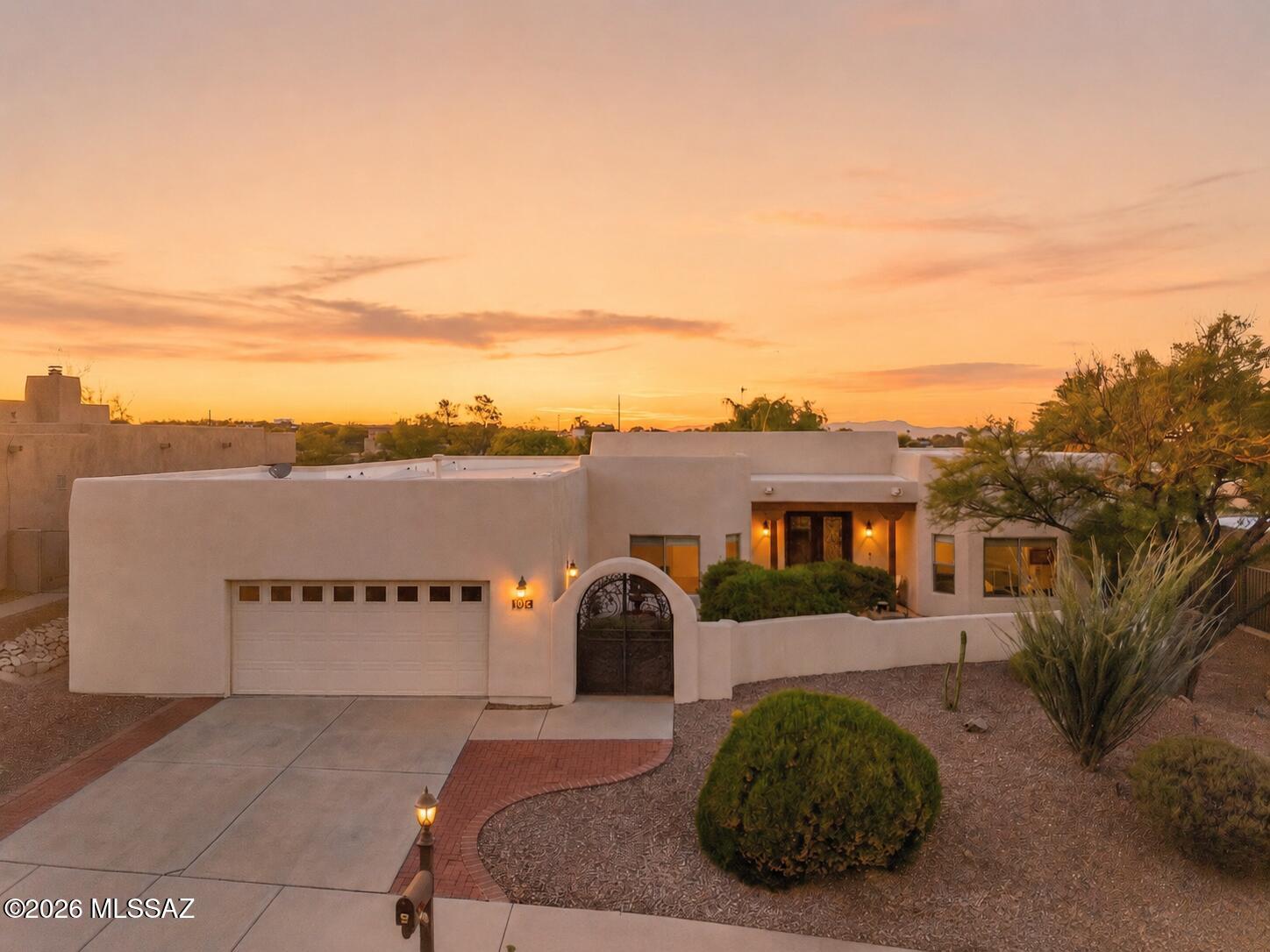 Luxury desert living in the Tucson Mountains with Catalina views and stunning upgrades throughout. Enter through a tranquil courtyard into a light filled home with soaring ceilings, four spacious bedrooms, and beautifully remodeled baths. The custom chef's kitchen features marble countertops, extensive cabinetry, oversized double ovens, stainless farmhouse sink, and a dramatic marble island with seating for four. New rear doors and windows enhance the indoor/outdoor connection and frame the resort style backyard with pool, spa, and multiple entertaining spaces. Enjoy Tucson's renowned dark skies and mountain views from your private oasis. Additional updates include newer HVAC systems, water heaters, pool equipment, and more. See the upgrade list in Documents.