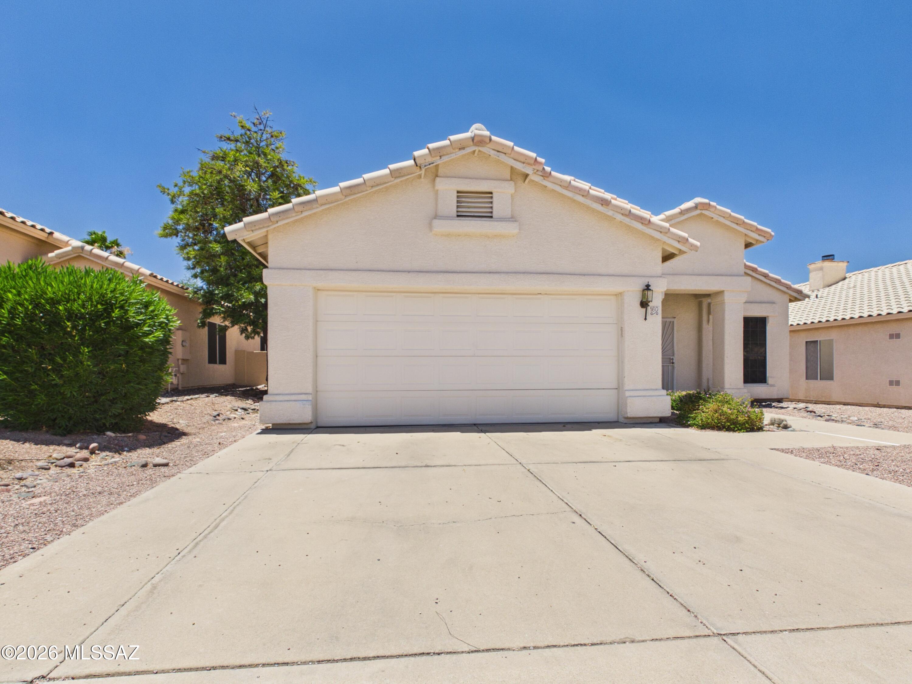 Welcome home to this well-maintained 3-bedroom, 2-bath home in the desirable Bristol Park community on Tucson's east side. Featuring a spacious open floor plan with vaulted ceilings, this home offers both a formal living and dining area plus a bright great room that flows into the updated kitchen with stainless steel appliances, a center island, and ample cabinet space. The split-bedroom layout provides added privacy, while the generous primary suite includes a walk-in closet, dual-sink vanity, garden tub, and separate shower. Enjoy the covered patio and low-maintenance backyard, plus a 2-car garage.