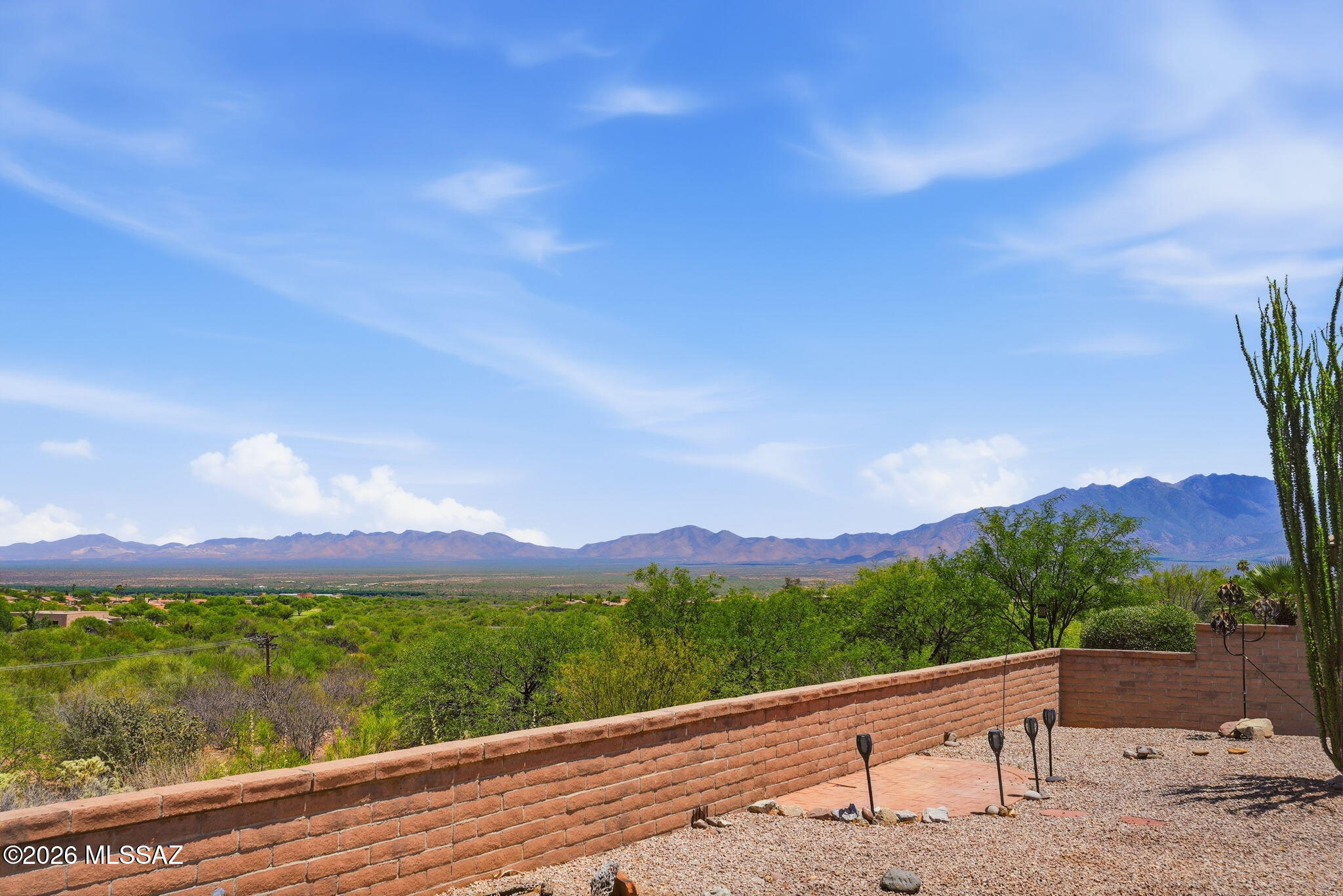 This home presents a rare opportunity for buyers with vision to create a distinctive Southwest retreat on an elevated lot with beautiful mountain views. From the moment you enter, you are welcomed into a bright great room and dining area filled with natural light and scenic views, creating a warm and inviting setting for entertaining or relaxing evenings at home.

The kitchen is designed for both everyday comfort and hosting, featuring a convenient breakfast bar that opens to the great room along with abundant cabinetry for excellent storage. The spacious primary suite serves as a peaceful retreat, complete with a bay window showcasing mountain views, a walk-in shower, dual vanity, and a large closet. A separate guest bedroom offers comfort and privacy for visiting family and friends. Step outside to the easy-care backyard, perfect for enjoying morning coffee, afternoon sunshine, or cool desert evenings under the stars. The garage provides additional storage space and functionality.

Conveniently located near golf courses, recreation centers, shopping, and dining, this home offers the chance to enjoy Green Valley's active adult lifestyle and the year-round beauty of the Southwest. Home is being sold as-is.